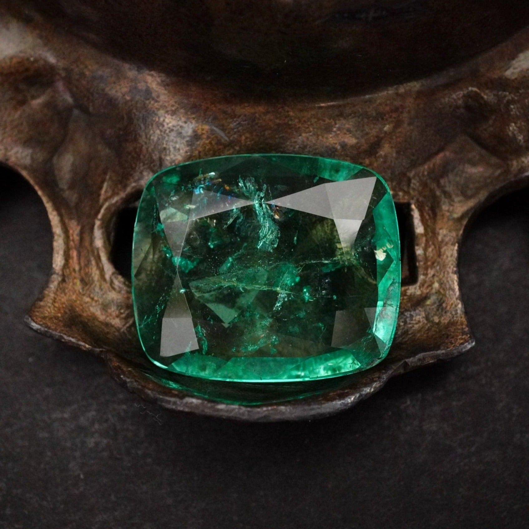 Experience the Charm of this 15.34 CT Cushion Colombian Emerald