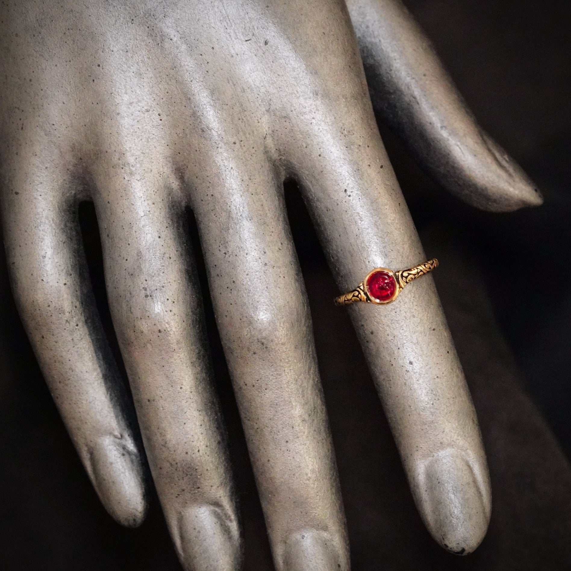 A mesmerizing 0.96 ct no-heat Burma ruby, glowing in vivid red, is elegantly cabochon-cut and bezel-set in 18K yellow gold—a Jogani creation that merges history and modern craftsmanship.