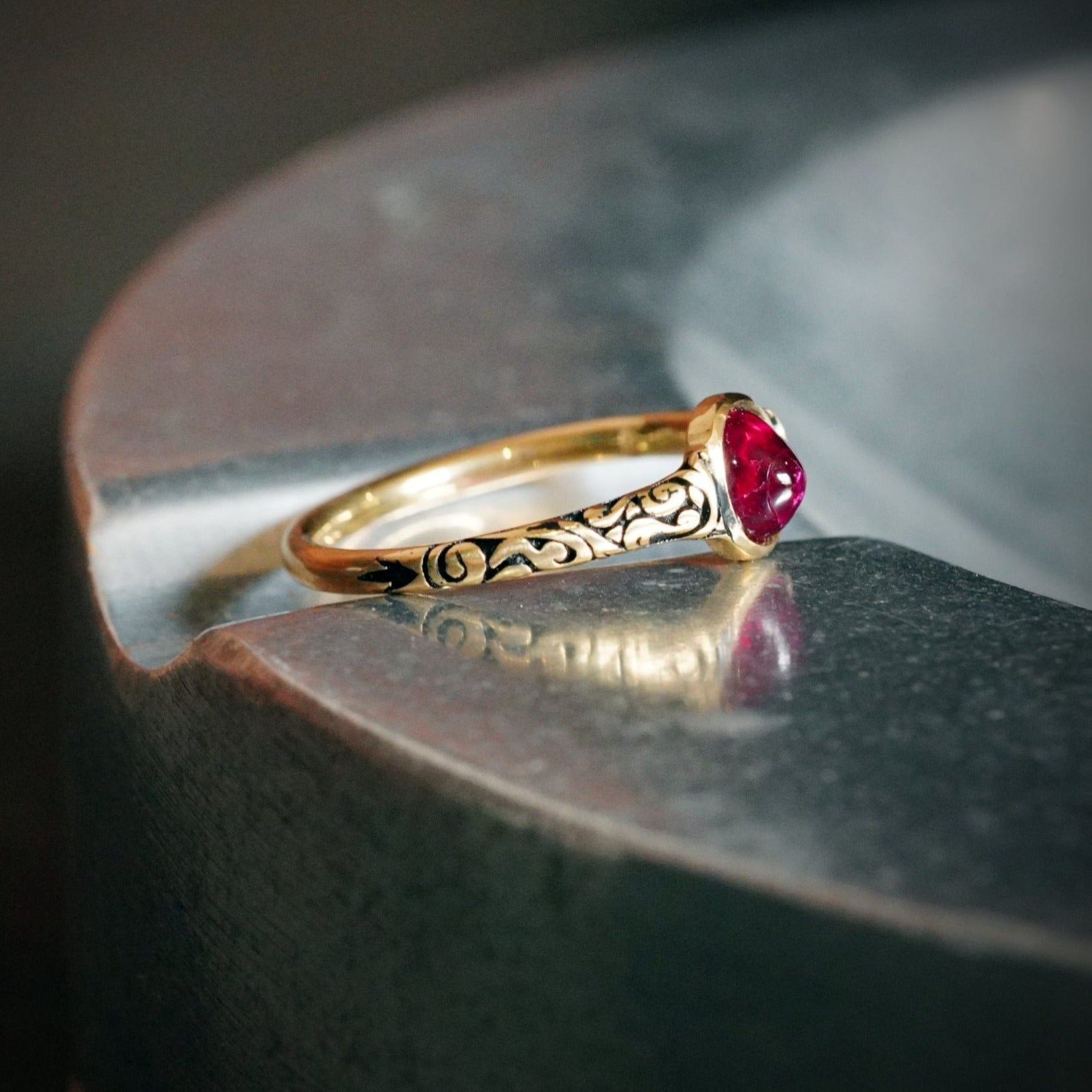 A regal 0.96 ct Burma ruby, cabochon-cut and set in luminous 18K yellow gold, available through Jogani’s expertly curated collection of collectible gemstones and fine jewelry.