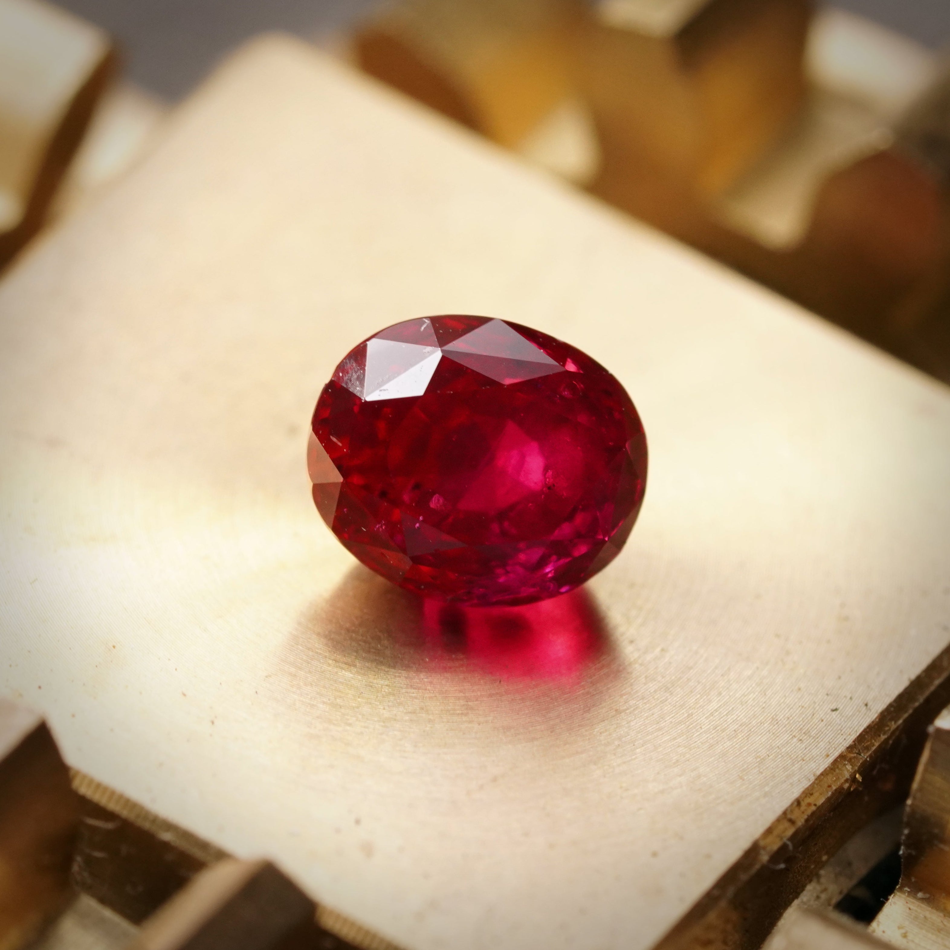 A 1.05-carat oval Burma ruby with a rich red hue, clean clarity, and no heat treatment, accompanied by AGL certificate number 1144921, presented by Jogani.