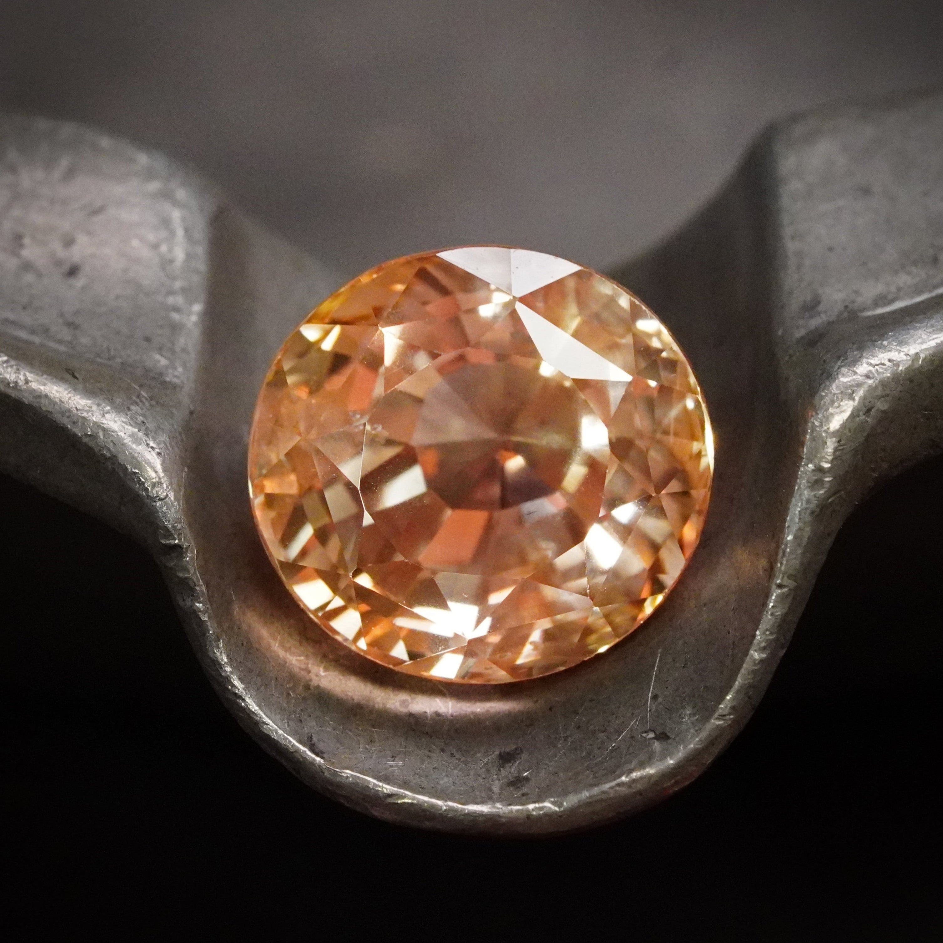 A 15.84 ct oval Ceylon sapphire, glowing in a rare light orange hue. This no-heat gem, sourced with passion by Jogani, is an extraordinary find for collectors.