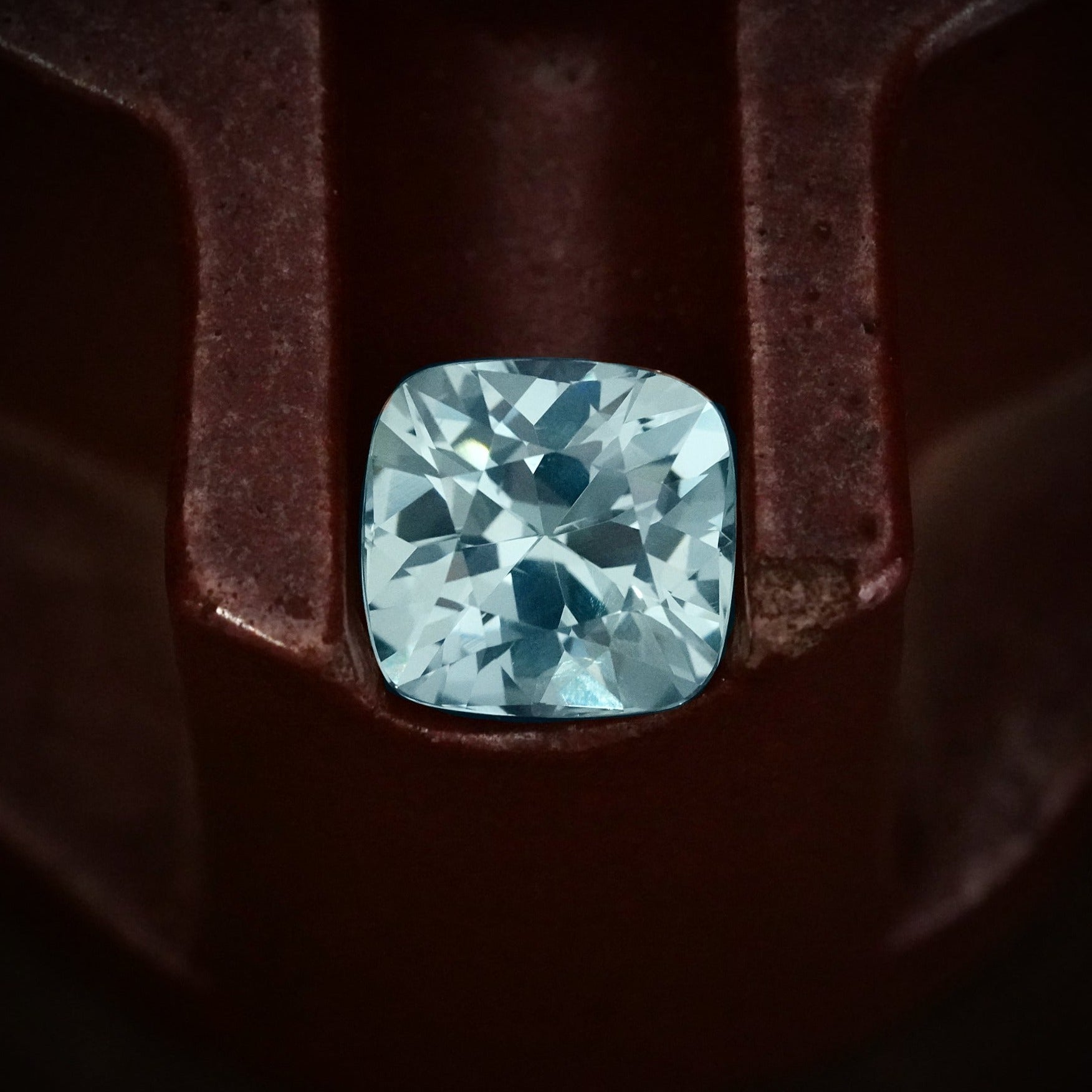 This exceptional 19.73 ct Burmese sapphire, cushion-cut and untreated, captivates with its clean clarity and vibrant tones—expertly sourced by Jogani.