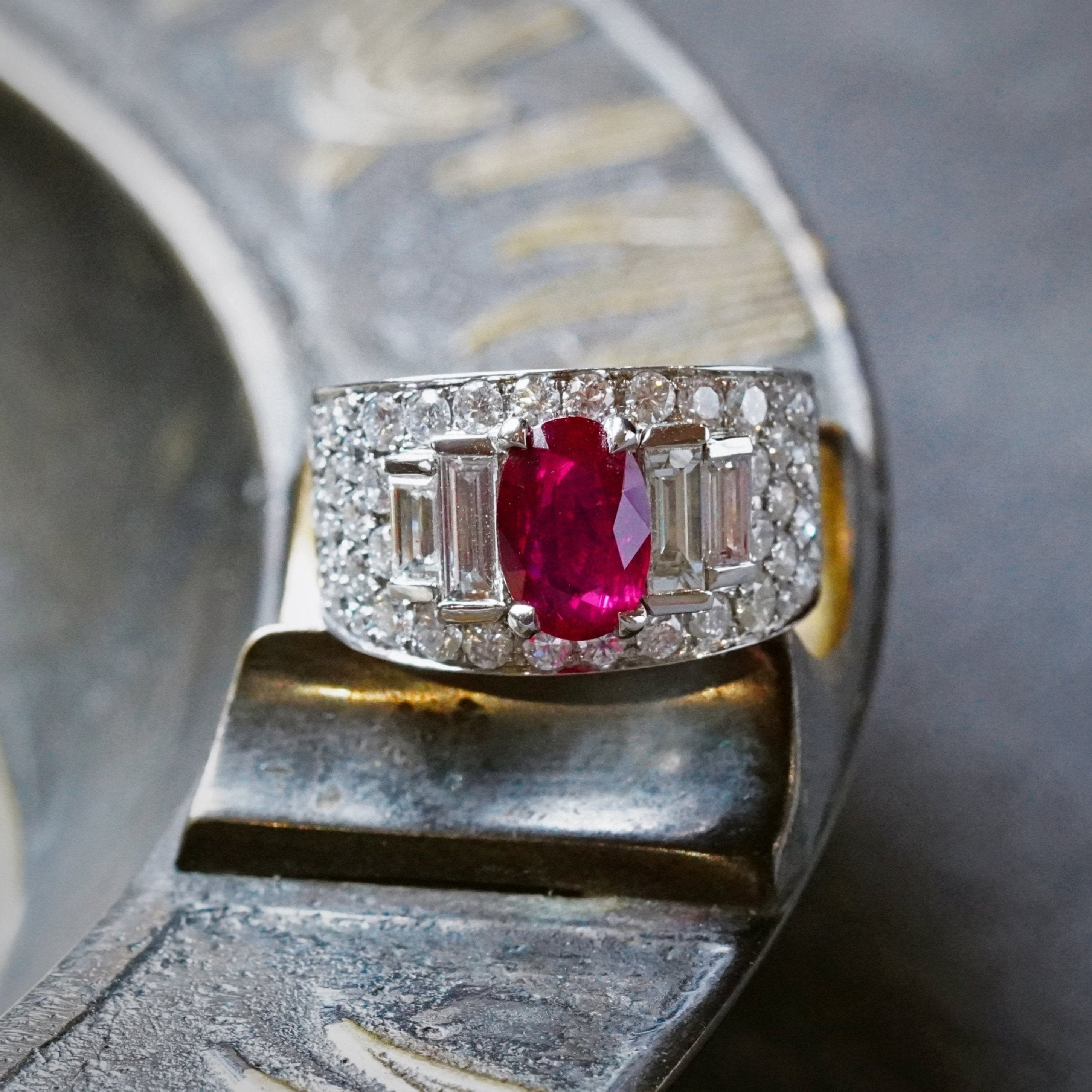 A vivid red, elongated cushion-cut Burmese ruby weighing 2.02 cts, set in a platinum open prong setting ring by Bulgari, accented by diamonds. Presented by Jogani.