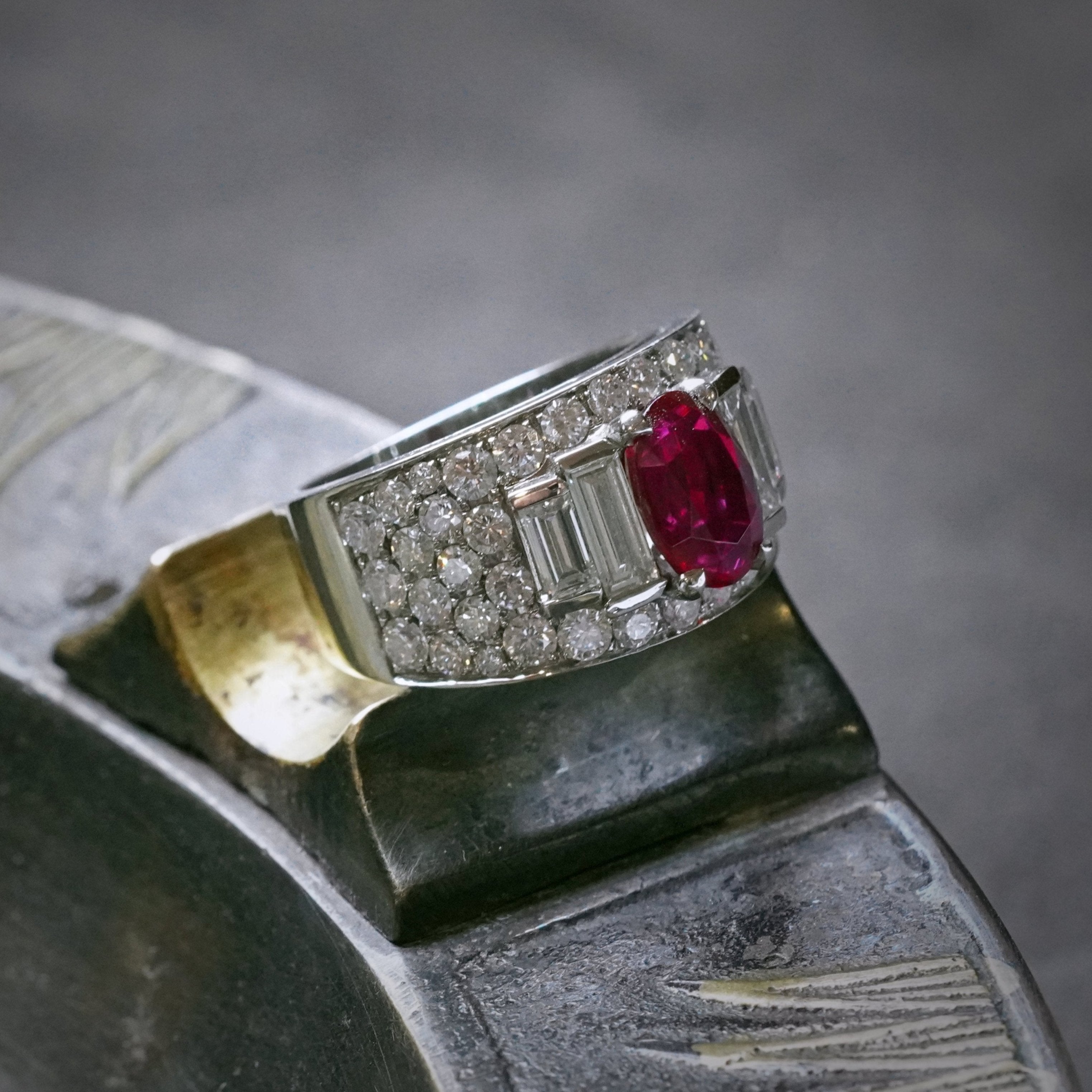 Jogani's vivid red, elongated cushion-cut Burmese ruby weighing 2.02 carats, set in a platinum open prong setting, accented by diamonds; crafted by Bulgari.