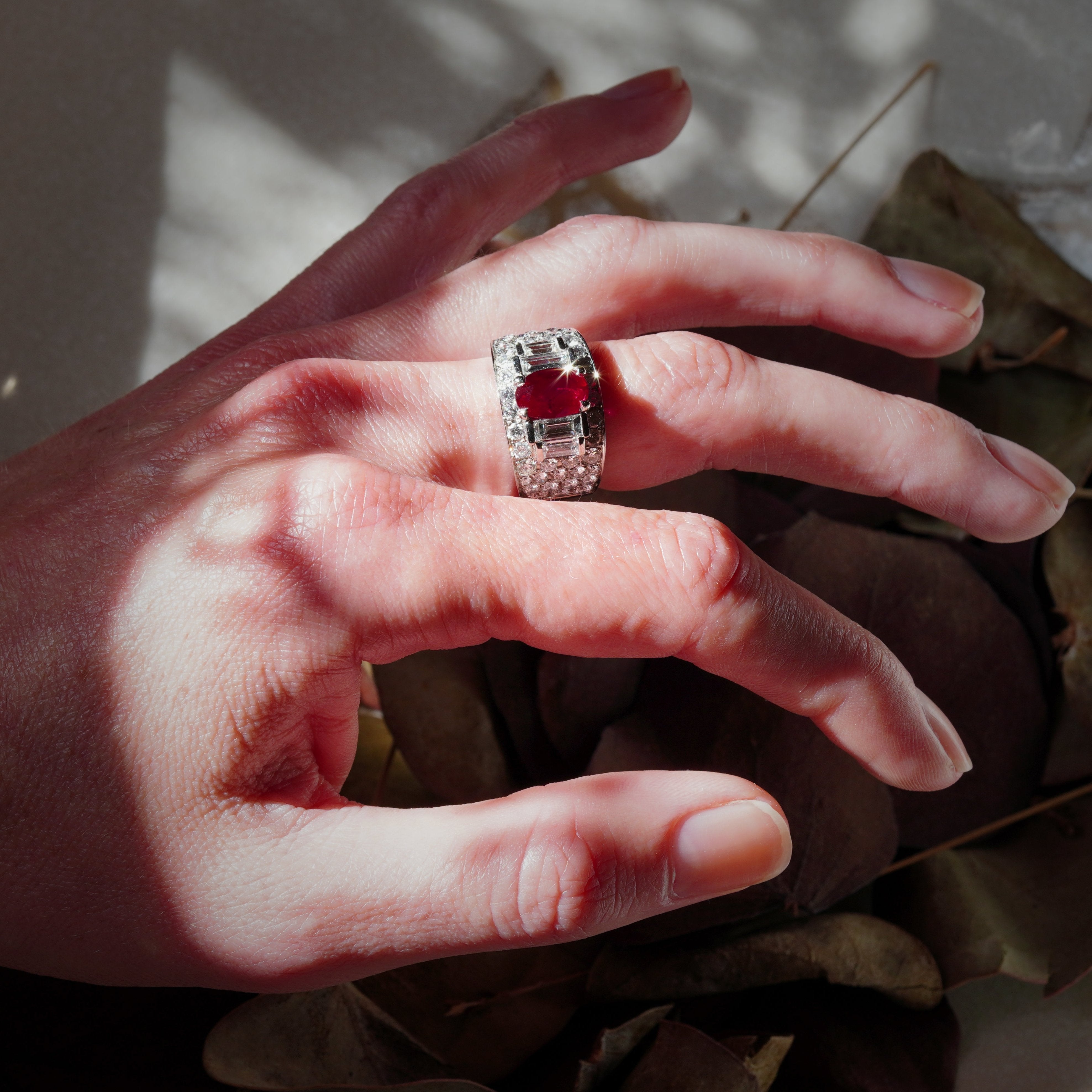 The 2.02 ct vivid red Burmese ruby ring worn on a size 6 finger, illustrating its elegance and presence; designed by Bulgari. Collect it from Jogani.