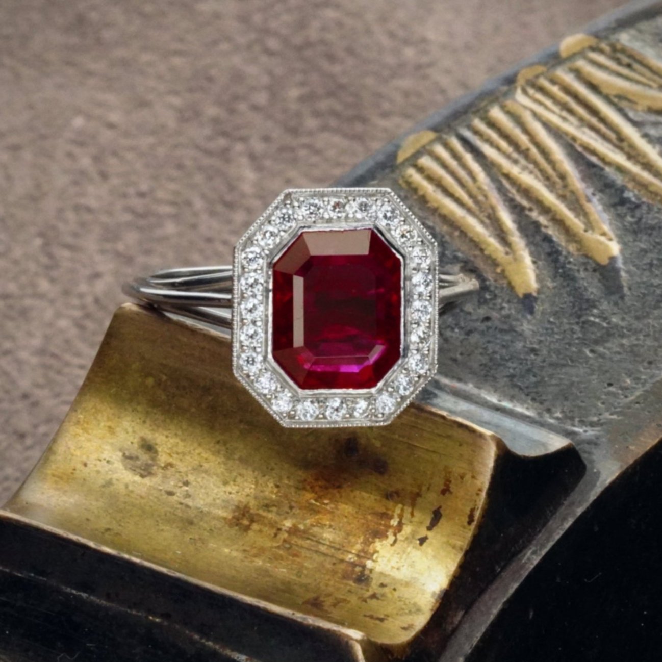 This handcrafted platinum ring from Jogani showcases a 2.13 ct no-heat Burma ruby in a step cut, complemented by sparkling diamond accents.