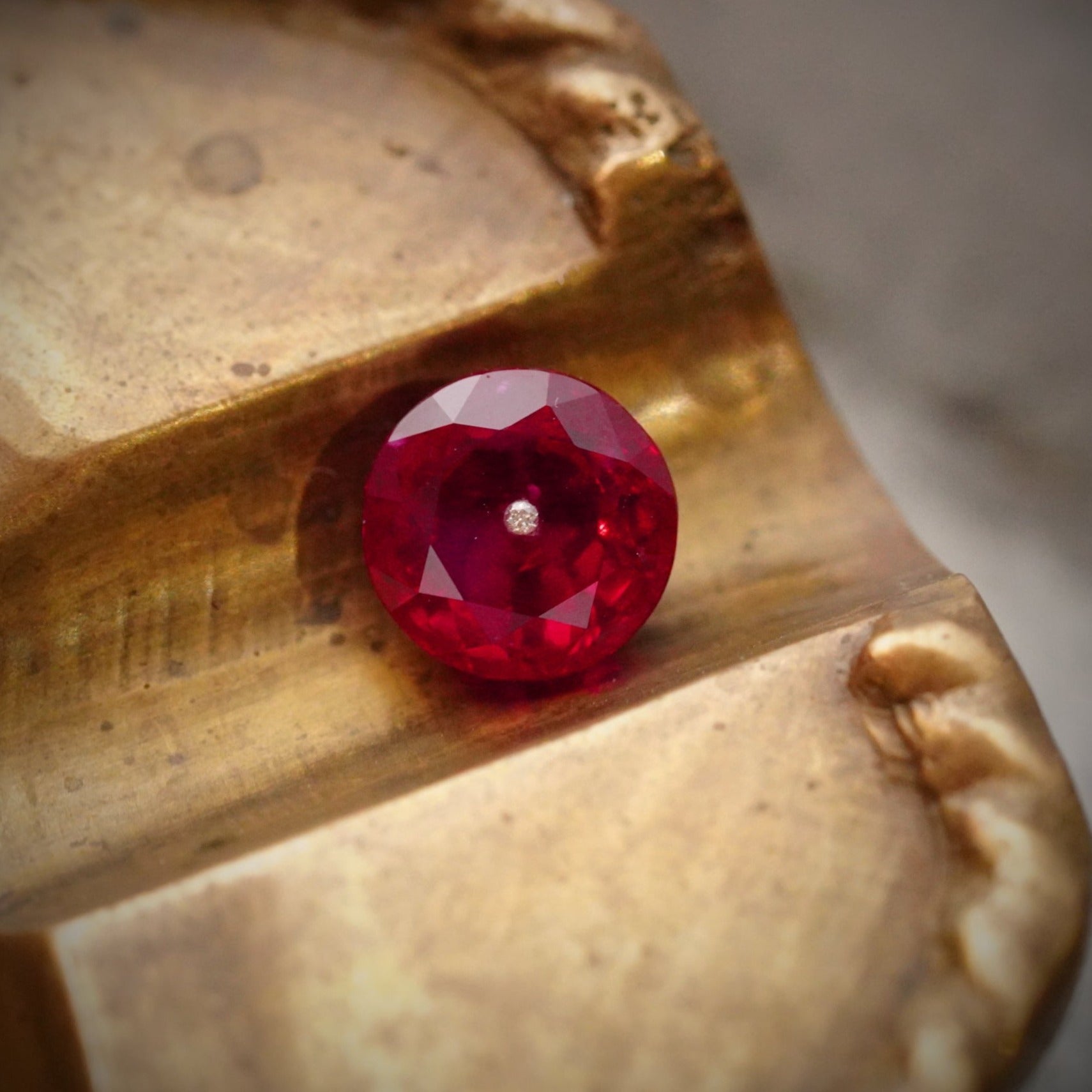 A captivating 2.57 ct Old Euro Burma ruby, no heat, with a drilled diamond eye—an extraordinary gemstone sourced by Jogani for collectors and designers alike.