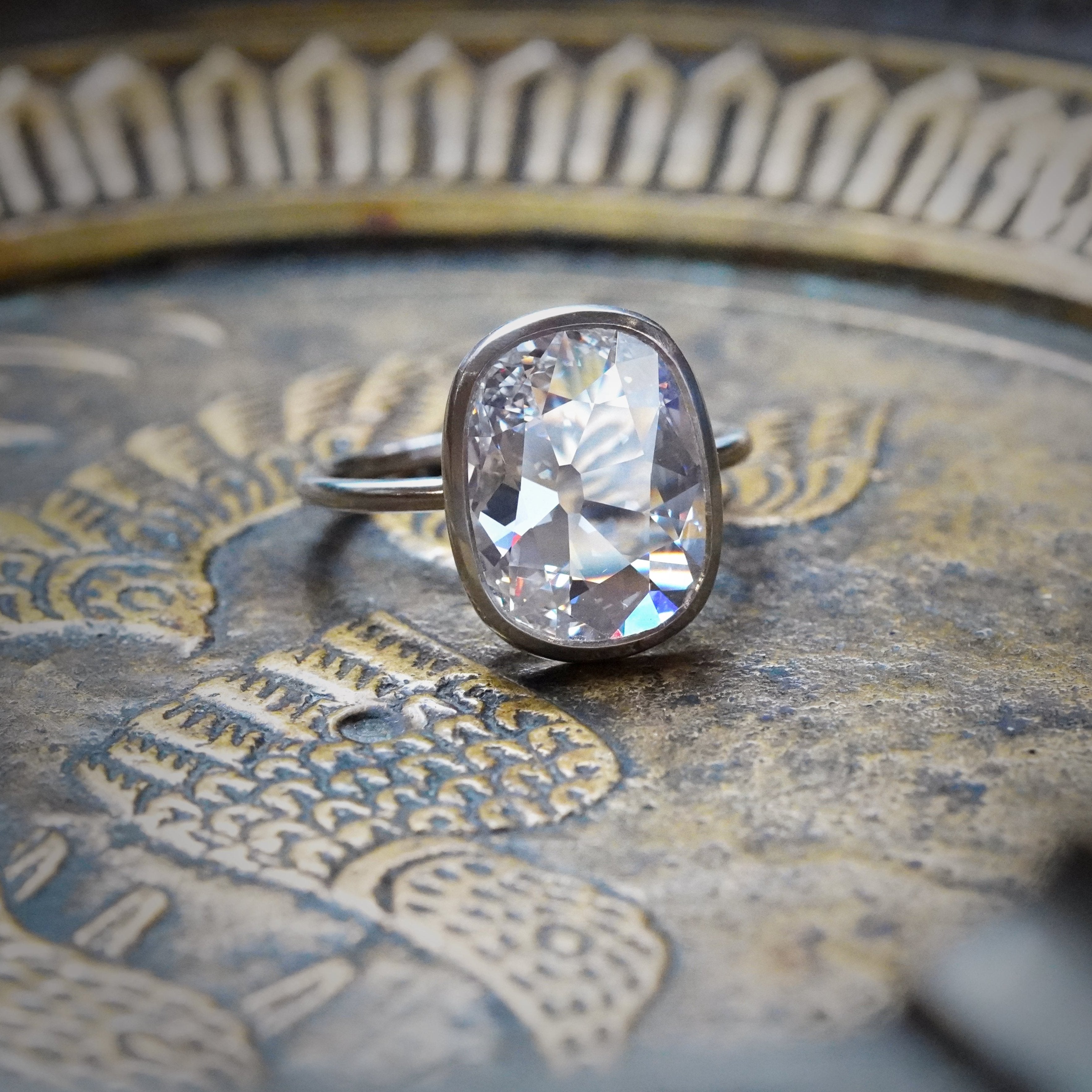 This breathtaking 3.02 ct cushion-cut diamond ring, GIA-certified with F color and internally flawless clarity, showcases exceptional craftsmanship in platinum. From Jogani.