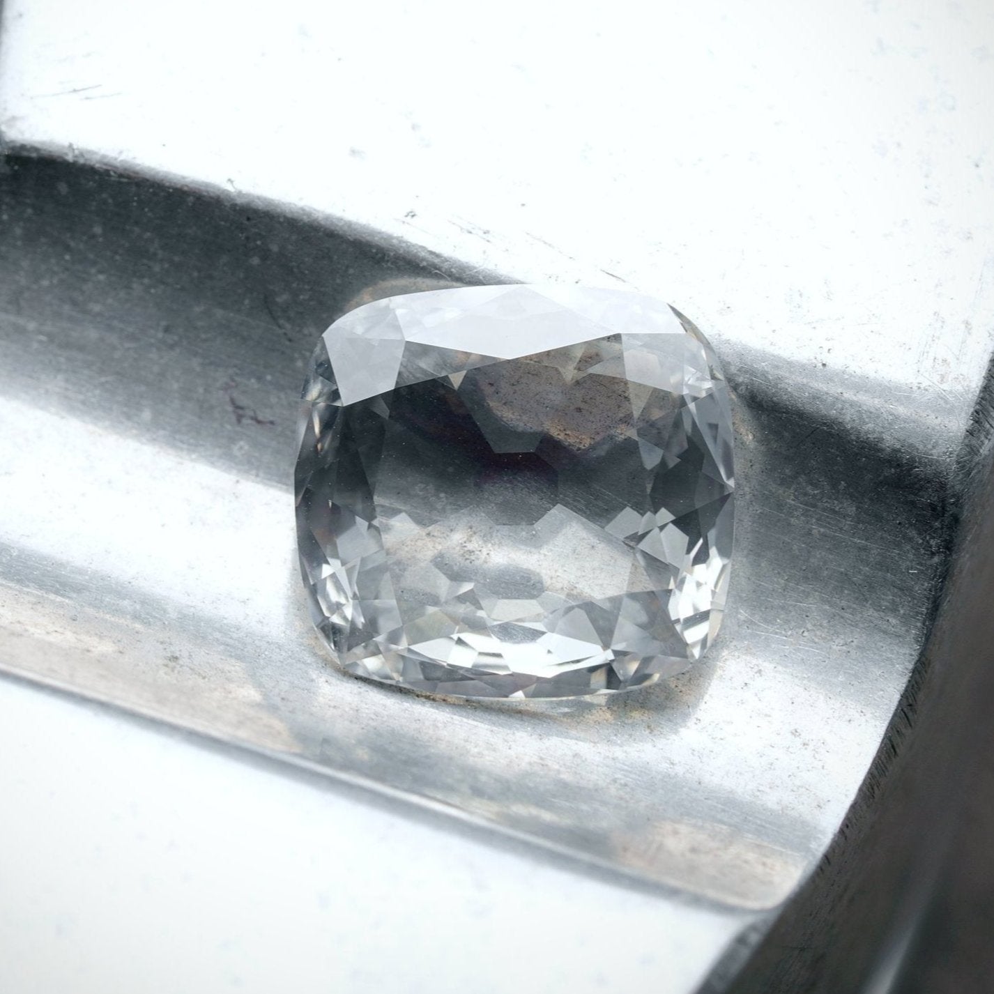 A 3.11 ct cushion-cut white diamond in its loose form, exhibiting SI1 clarity and I color—an exceptional gem later transformed into a Jogani masterpiece.