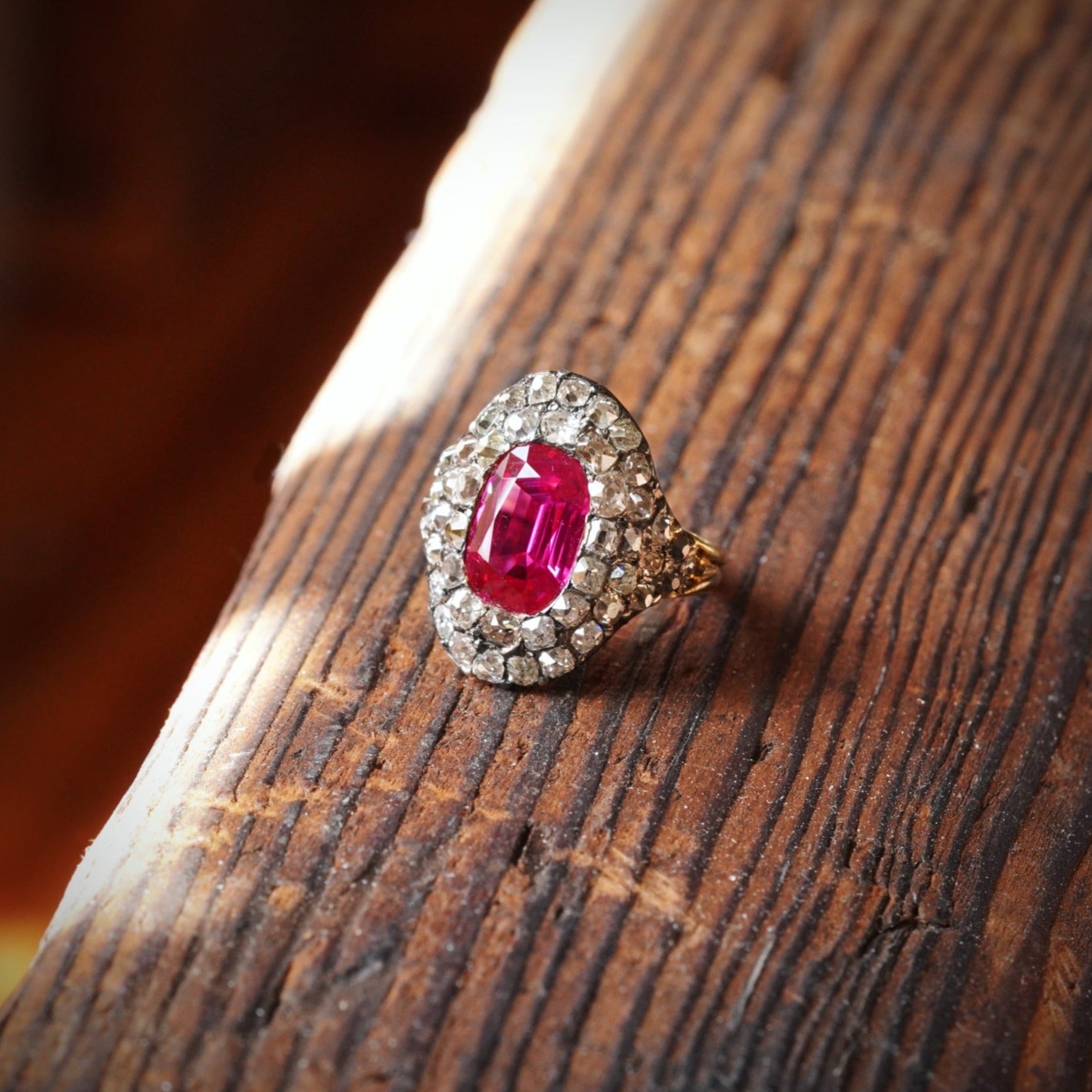 An extraordinary Georgian-era Burma Ruby and Diamond Ring, featuring a 3.12 ct unheated cushion-cut ruby, bezel-set in rich 18K gold. A collector’s treasure available with Jogani.