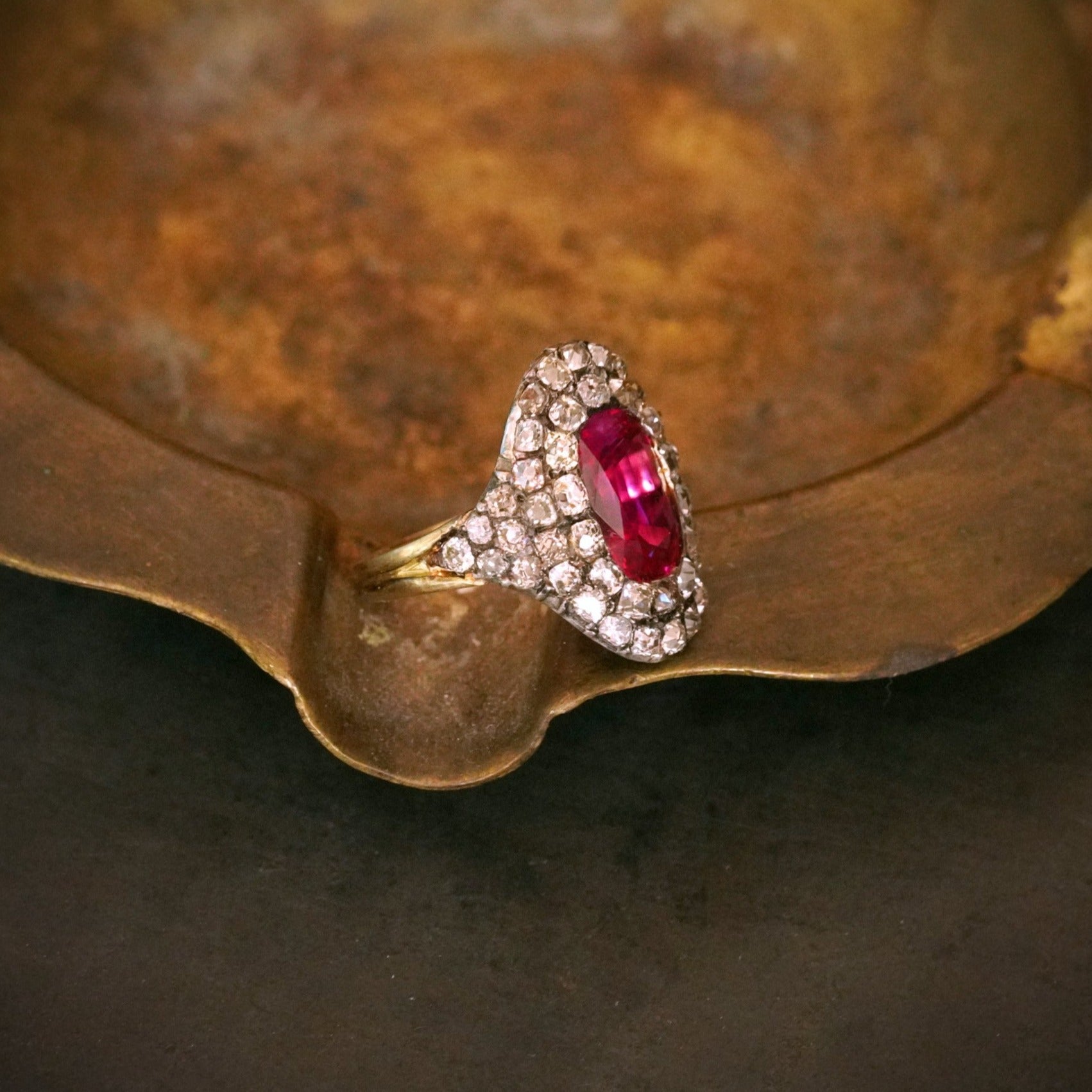 An extraordinary Georgian-era Burma Ruby and Diamond Ring, featuring a 3.12 ct unheated cushion-cut ruby, bezel-set in rich 18K gold. A collector’s treasure available with Jogani.