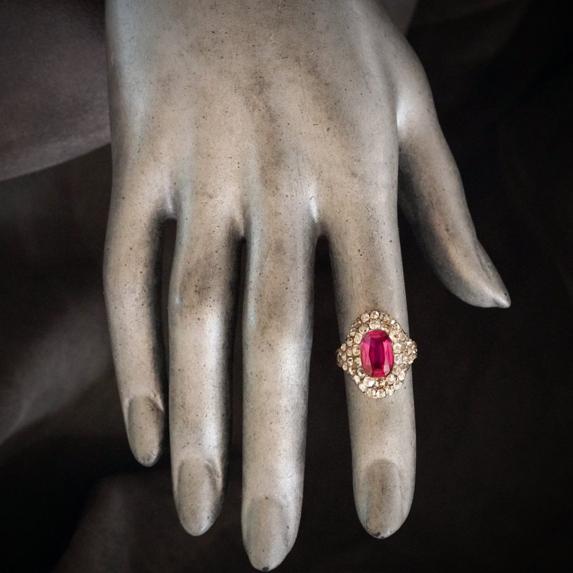 A striking Georgian-era ring featuring a 3.12 ct pink-red cushion-cut Burma Ruby, glowing with unmatched brilliance. Expertly sourced and available with Jogani.