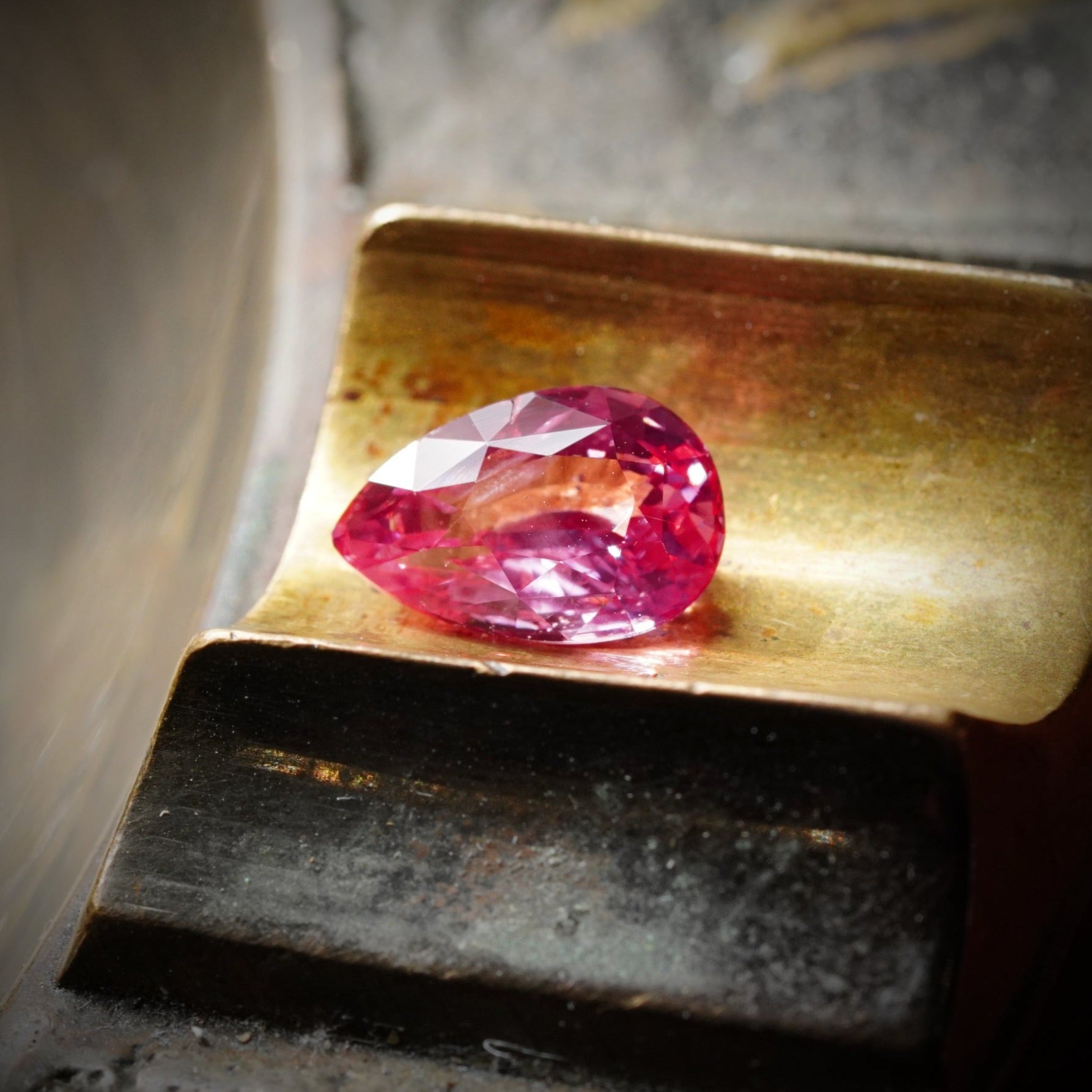 The breathtaking 3.14 ct no-heat Ceylon Padparadscha sapphire, pear cut, glowing with an orangy-pink hue—an exceptional creation by Jogani.