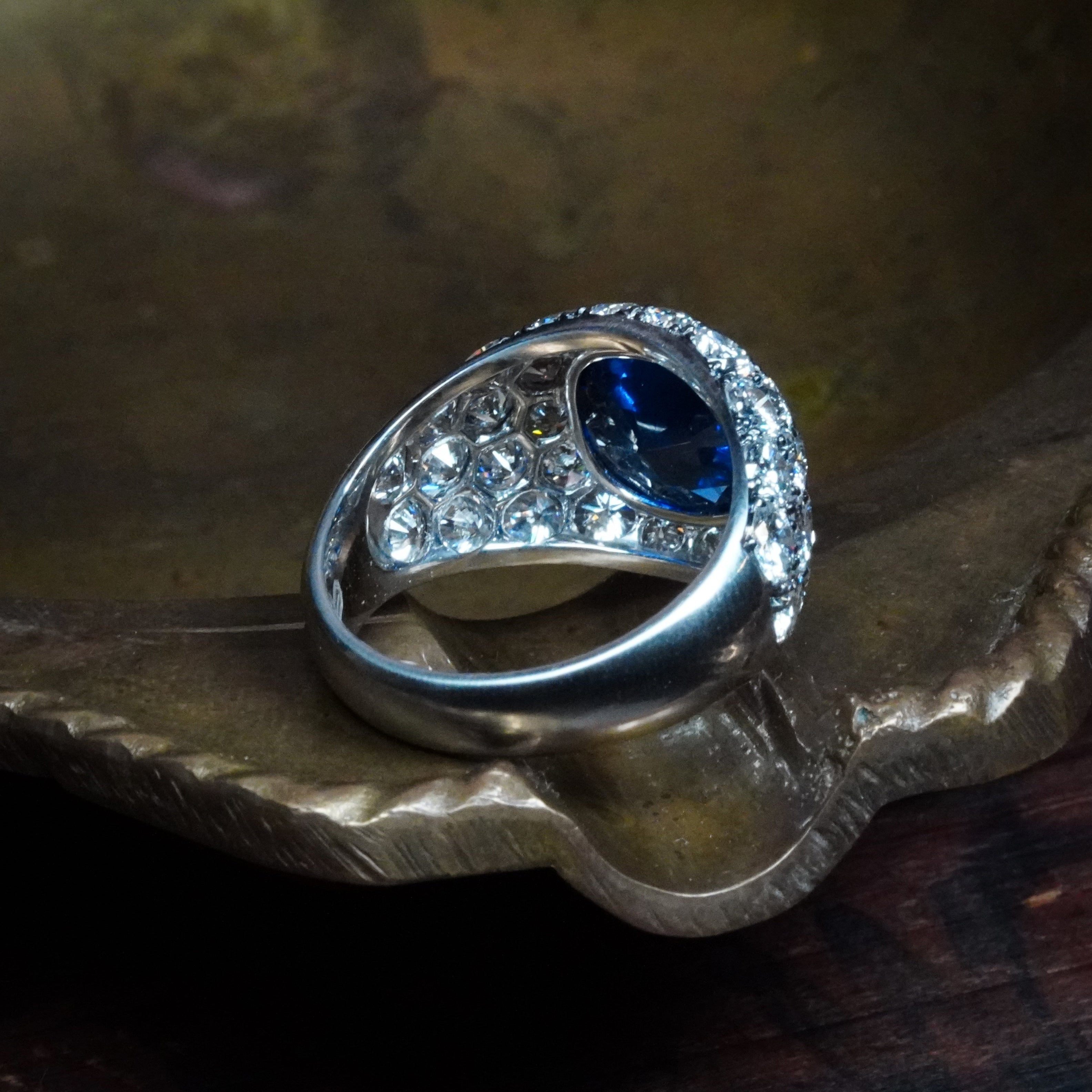 A stunning no-heat Burma sapphire, cushion-cut at 3.39 ct, set in platinum with dazzling diamond accents—another exceptional piece from Jogani.