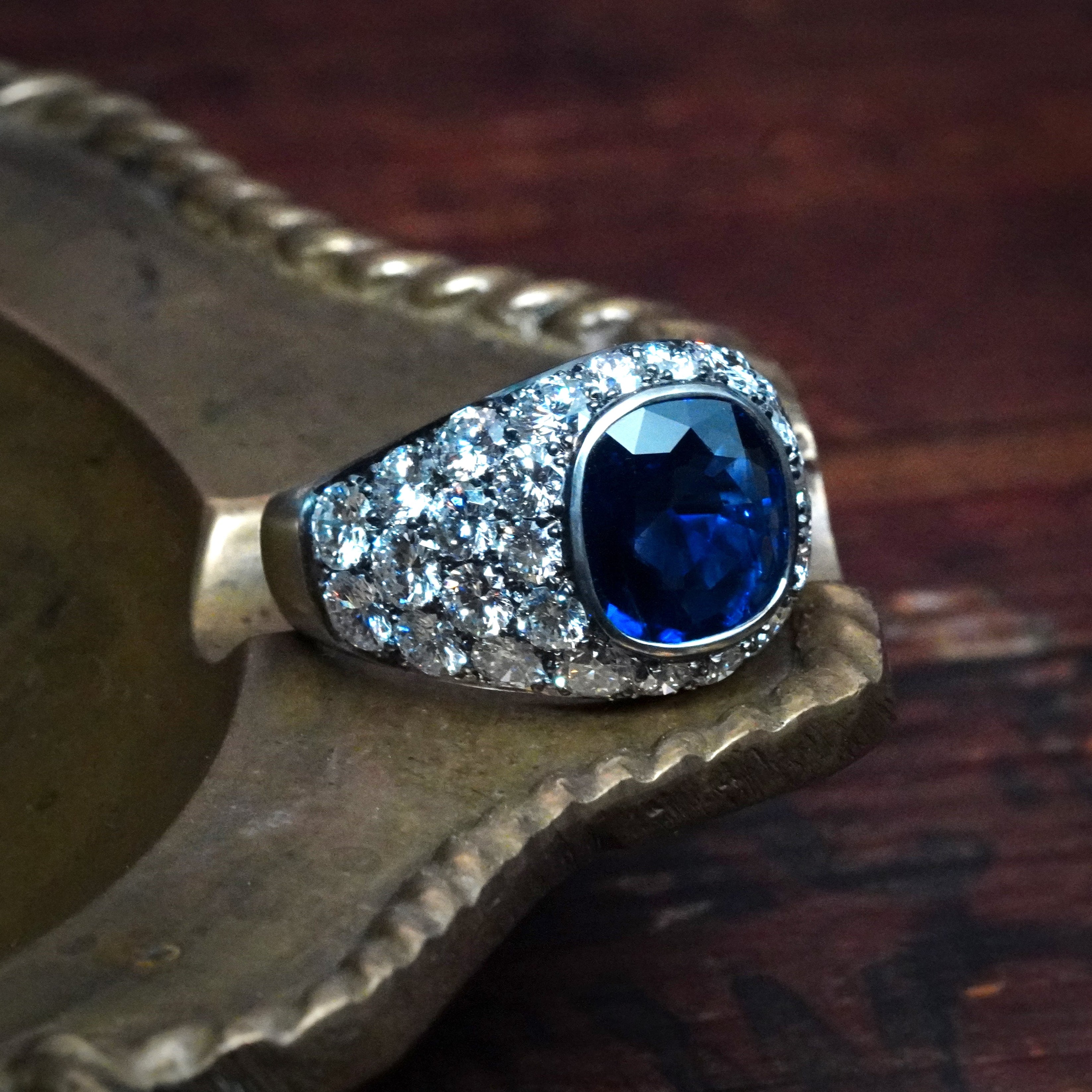 A masterful creation by Jogani, this platinum ring features a clean 3.39 ct no-heat Burma sapphire, surrounded by brilliant diamonds for extra radiance.