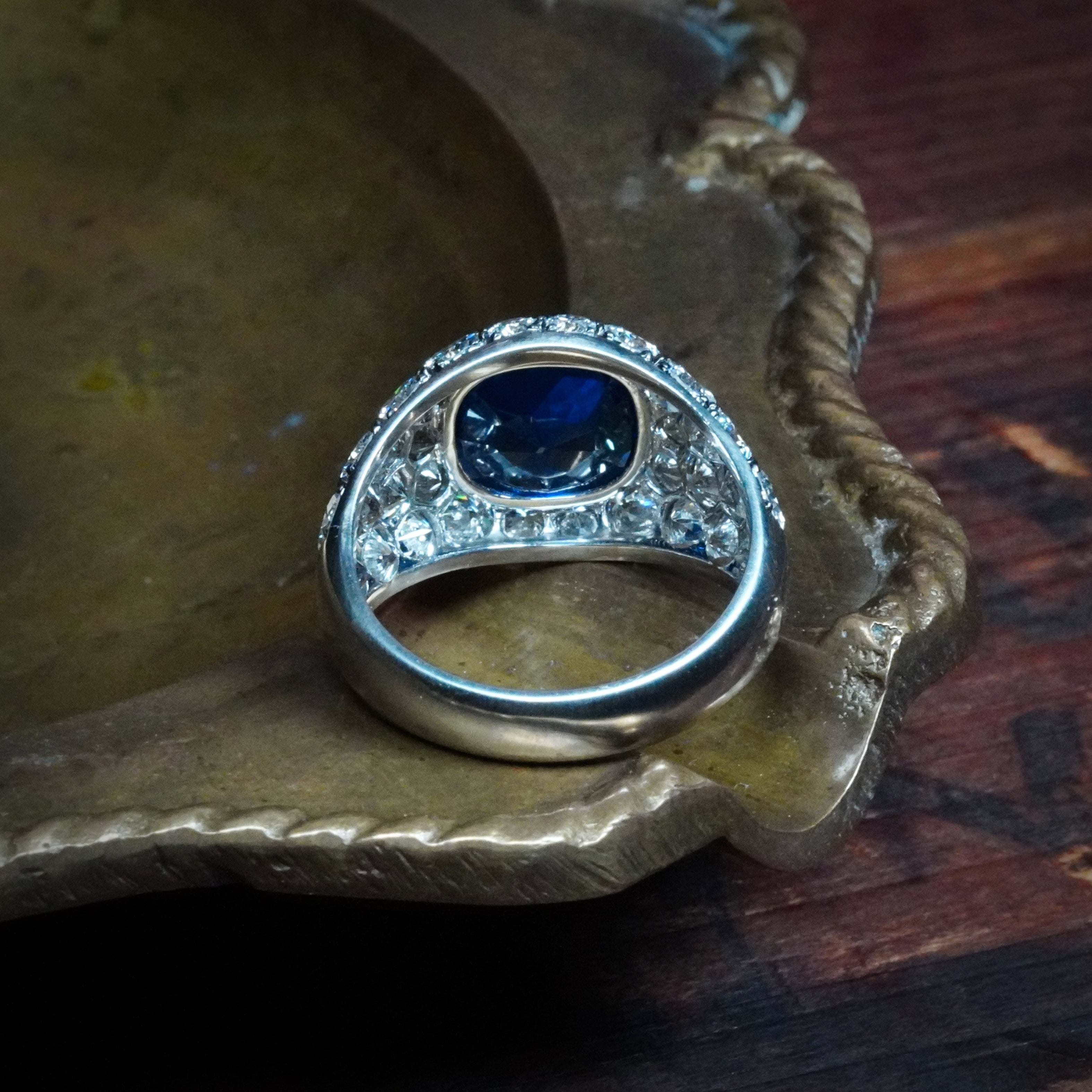 Jogani’s passion for rare gemstones shines in this 3.39 ct Burma sapphire ring, featuring a bezel setting and 3.16 tcw of diamonds for added brilliance.