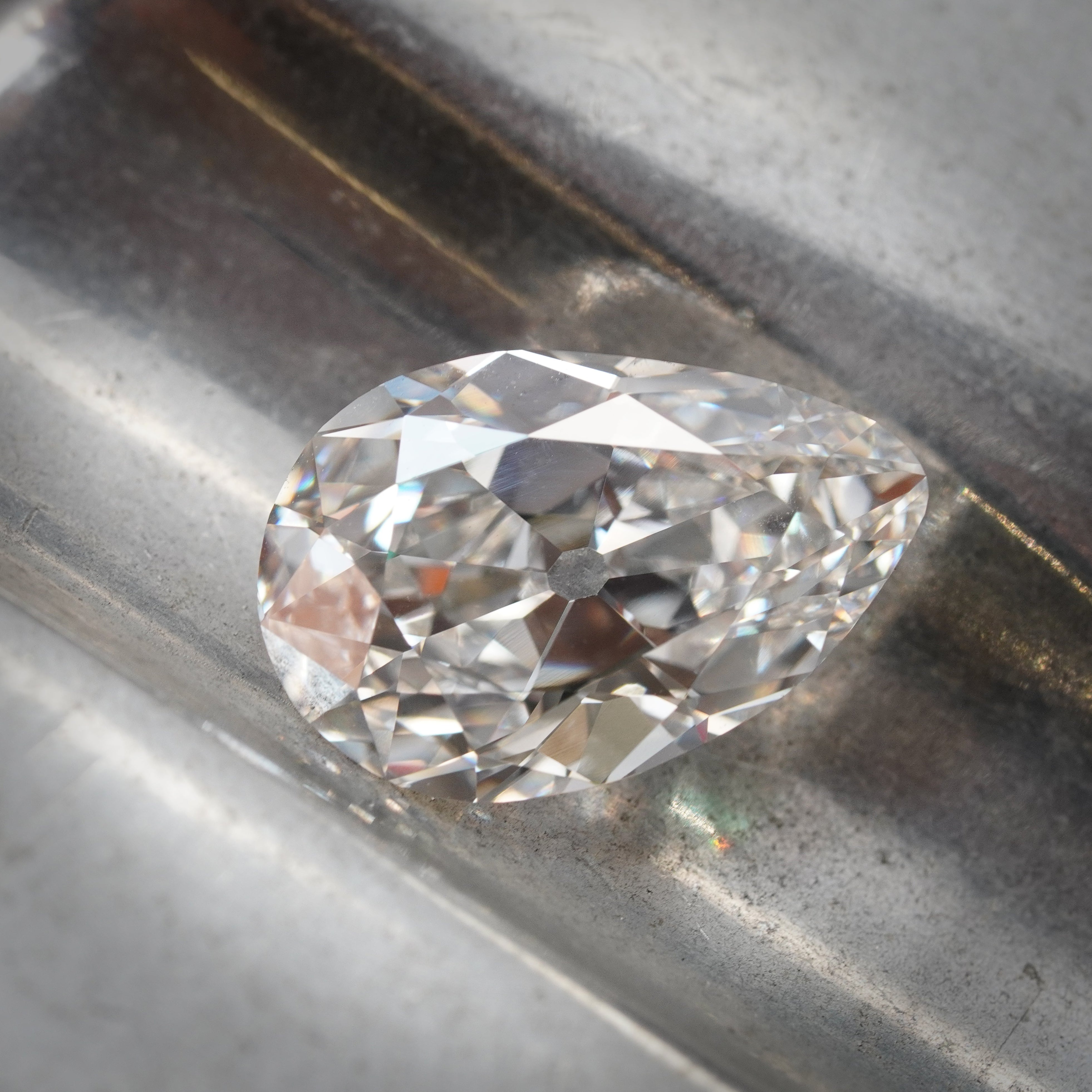 A stunning 4.20 ct pear cut white diamond with E color and VS1 clarity, measuring 13.78 x 9.11 x 5.25 mm. GIA certified, showcasing exceptional brilliance.