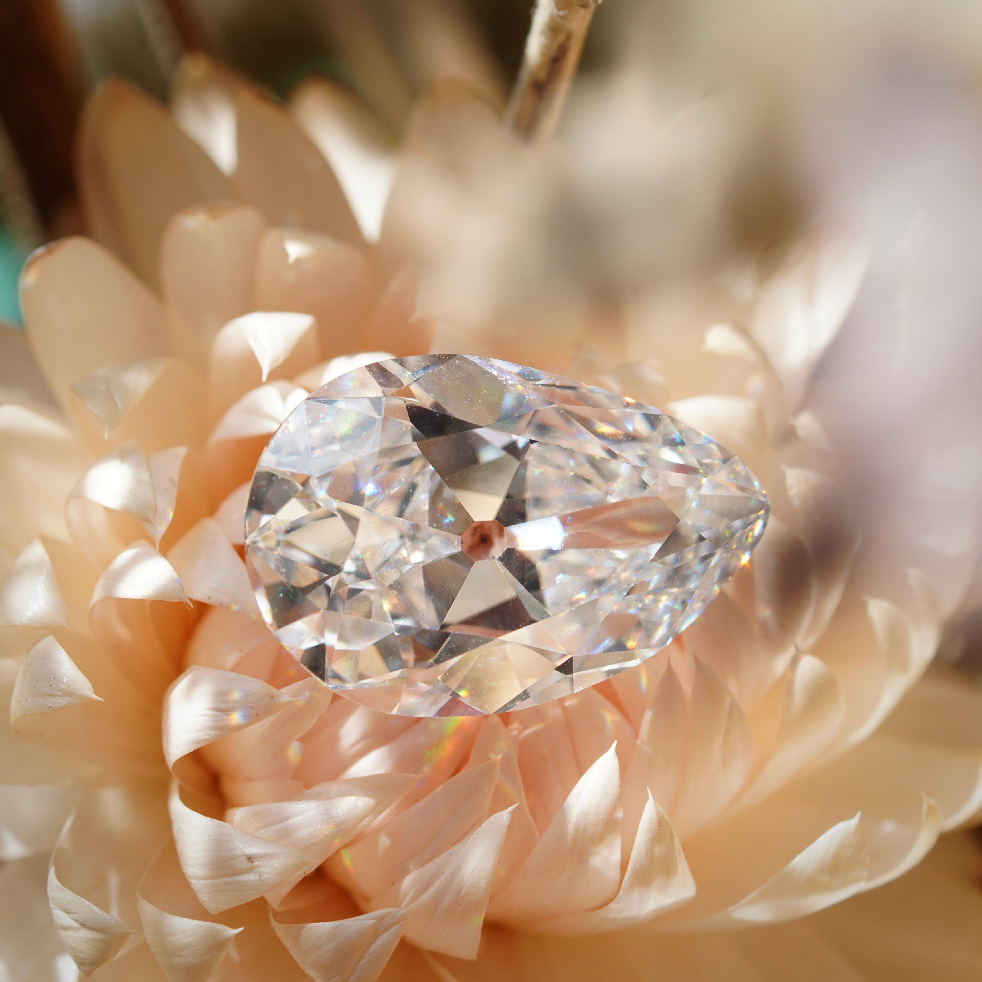 A stunning 4.20 ct pear cut white diamond with E color and VS1 clarity, measuring 13.78 x 9.11 x 5.25 mm. GIA certified, showcasing exceptional brilliance.