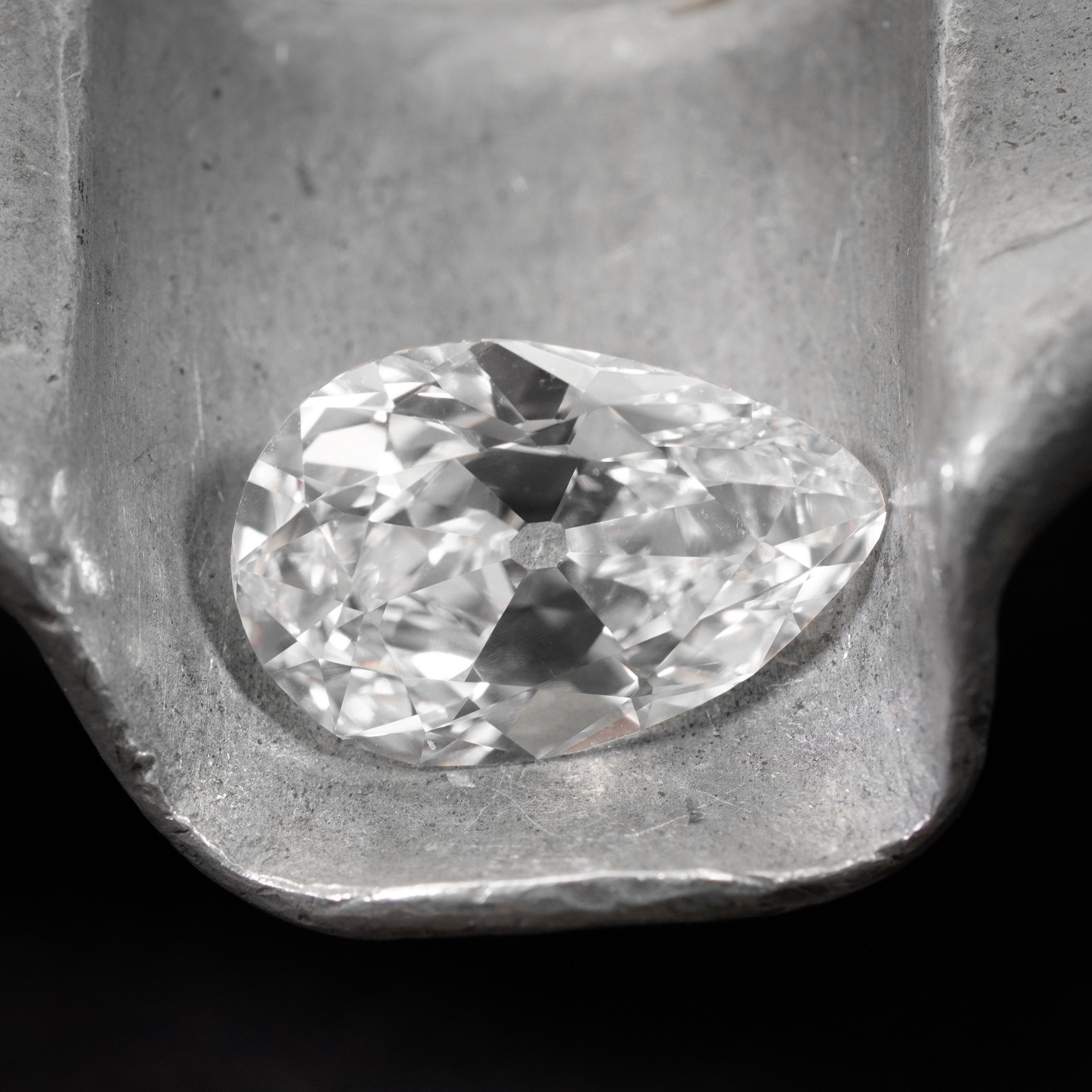 A stunning 4.20 ct pear cut white diamond with E color and VS1 clarity, measuring 13.78 x 9.11 x 5.25 mm. GIA certified, showcasing exceptional brilliance.