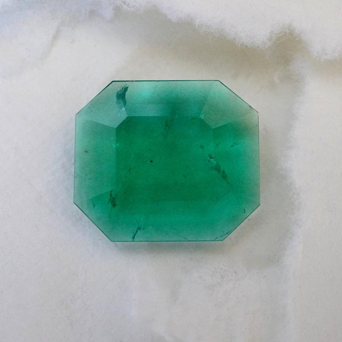 A rare 4.48 ct step-cut Colombian emerald, completely untreated and glowing with natural green brilliance, available with Jogani in a gold ring.