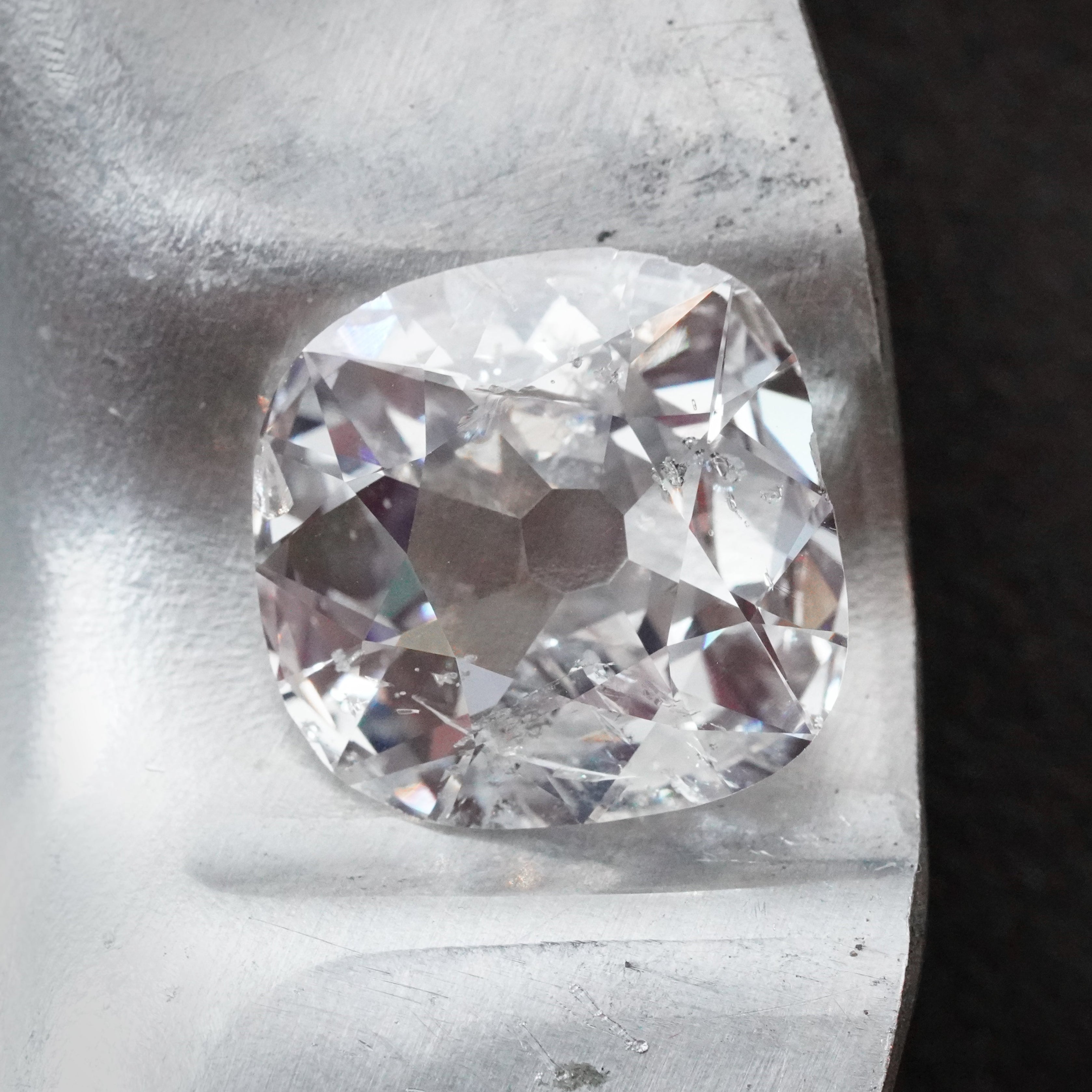 A 5.02-carat cushion-cut diamond with G color and I2 clarity, measuring 12.96 x 12.63 x 4.28 mm, accompanied by GIA certificate number 5231488524, presented by Jogani.