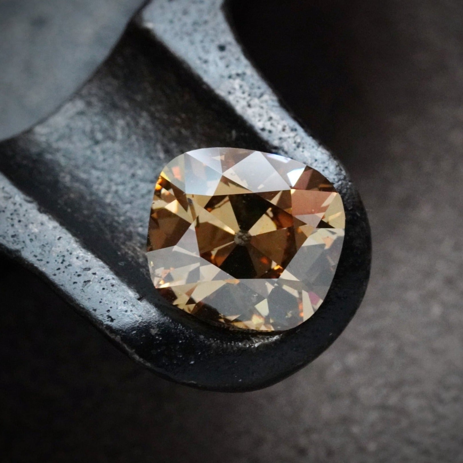 This 5.02 ct Old Mine cut diamond, available through Jogani, embodies the charm of antique diamonds with its unique faceting and mesmerizing color, making it a perfect choice for custom jewelry.