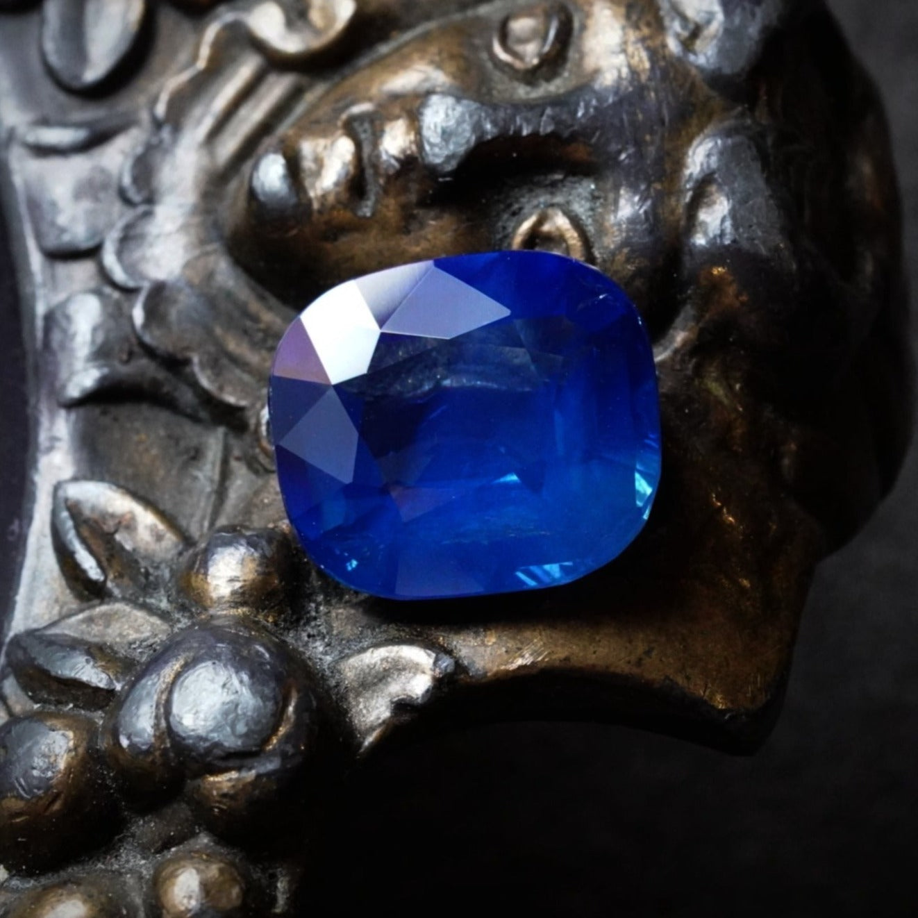 A coveted 5.13 ct cushion-cut Kashmir sapphire, no heat, displaying a mesmerizing blue with strong saturation. SSEF-certified and exclusively available with Jogani.