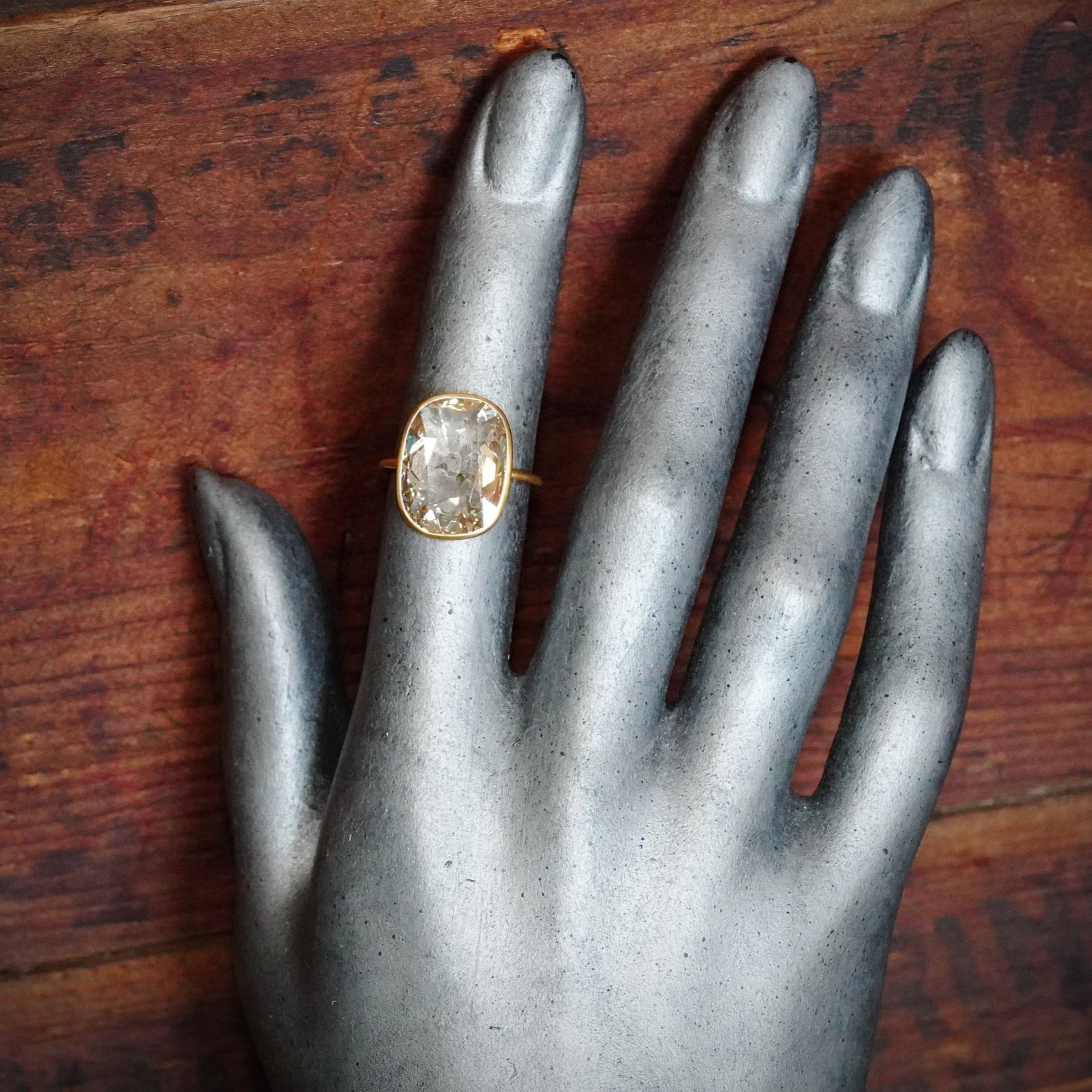 A rare 5.53 ct Old Mine-cut diamond ring, showcasing a Fancy Light Brownish Yellow hue with internally flawless clarity. Handcrafted in 22K gold and platinum by Jogani.