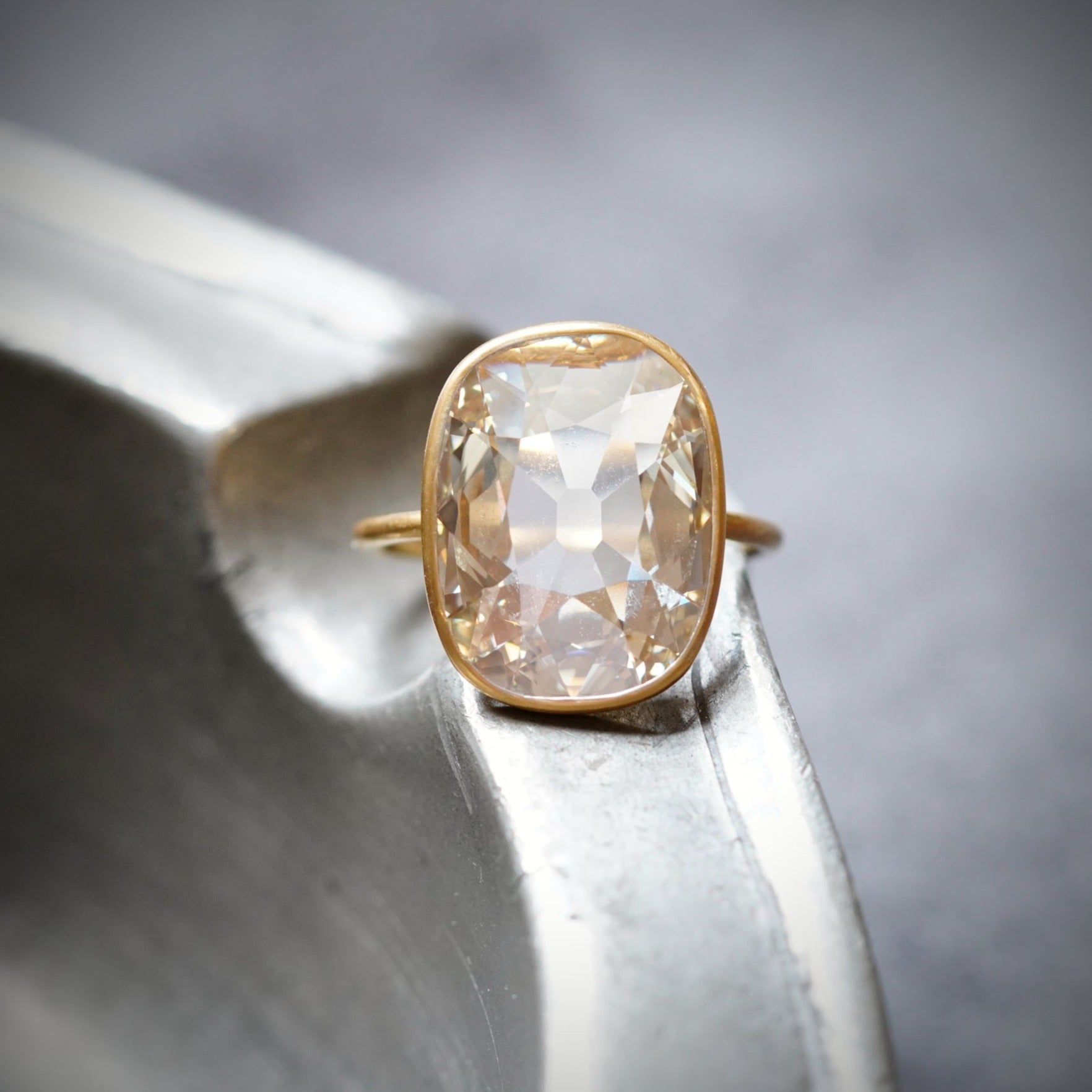 An extraordinary 5.53 ct Old Mine-cut diamond ring, showcasing a Fancy Light Brownish Yellow hue with internally flawless clarity. Handcrafted in 22K gold and platinum by Jogani.