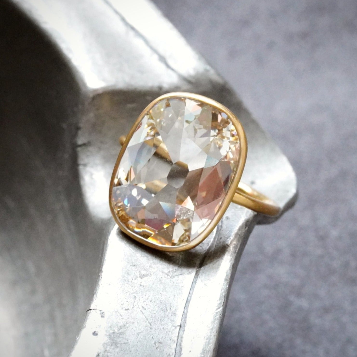 A one-of-a-kind 5.53 ct elongated flat Old Mine-cut diamond, Fancy Light Brownish Yellow, internally flawless, bezel-set in 22K gold with a platinum insert. Available with Jogani.