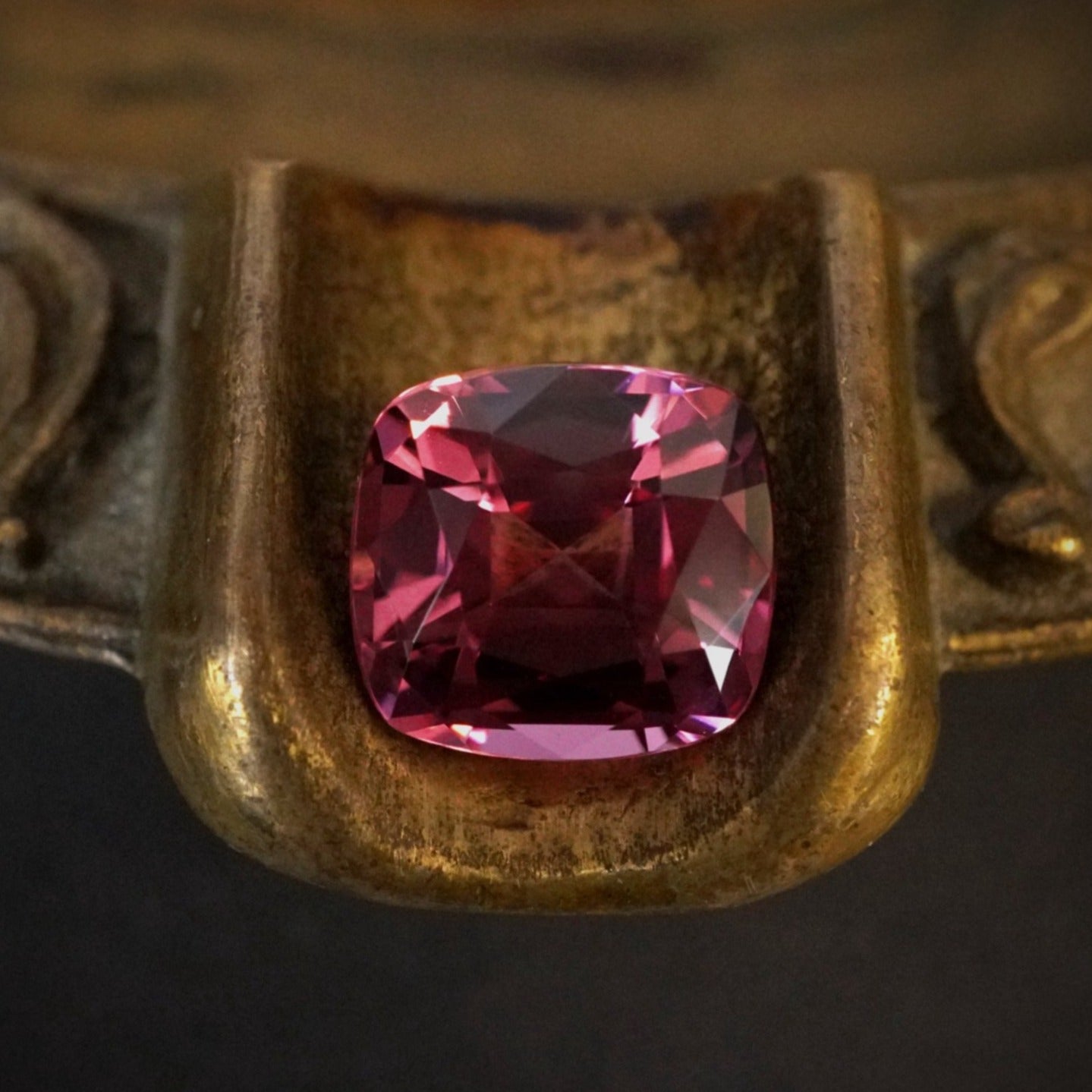 A dazzling 5.76 ct cushion-cut Burma spinel in its loose form, radiating vivid pink hues. This rare, no-heat gem is hand-selected by Jogani for its exceptional beauty.