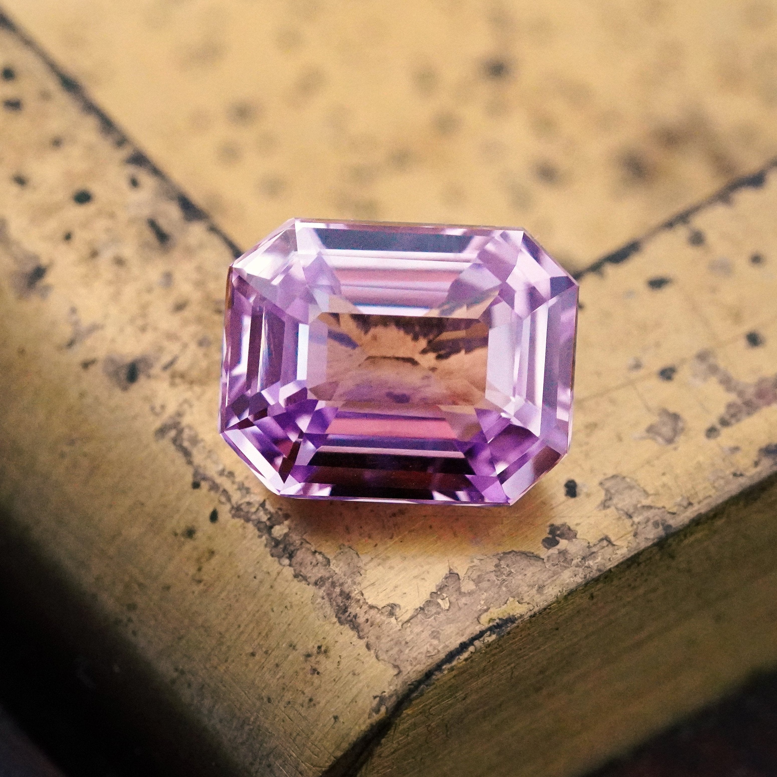 A rare 7.01 ct step-cut lavender Ceylon sapphire, available from Jogani, featuring no heat treatment and exceptional clarity. A unique and collectible gemstone.