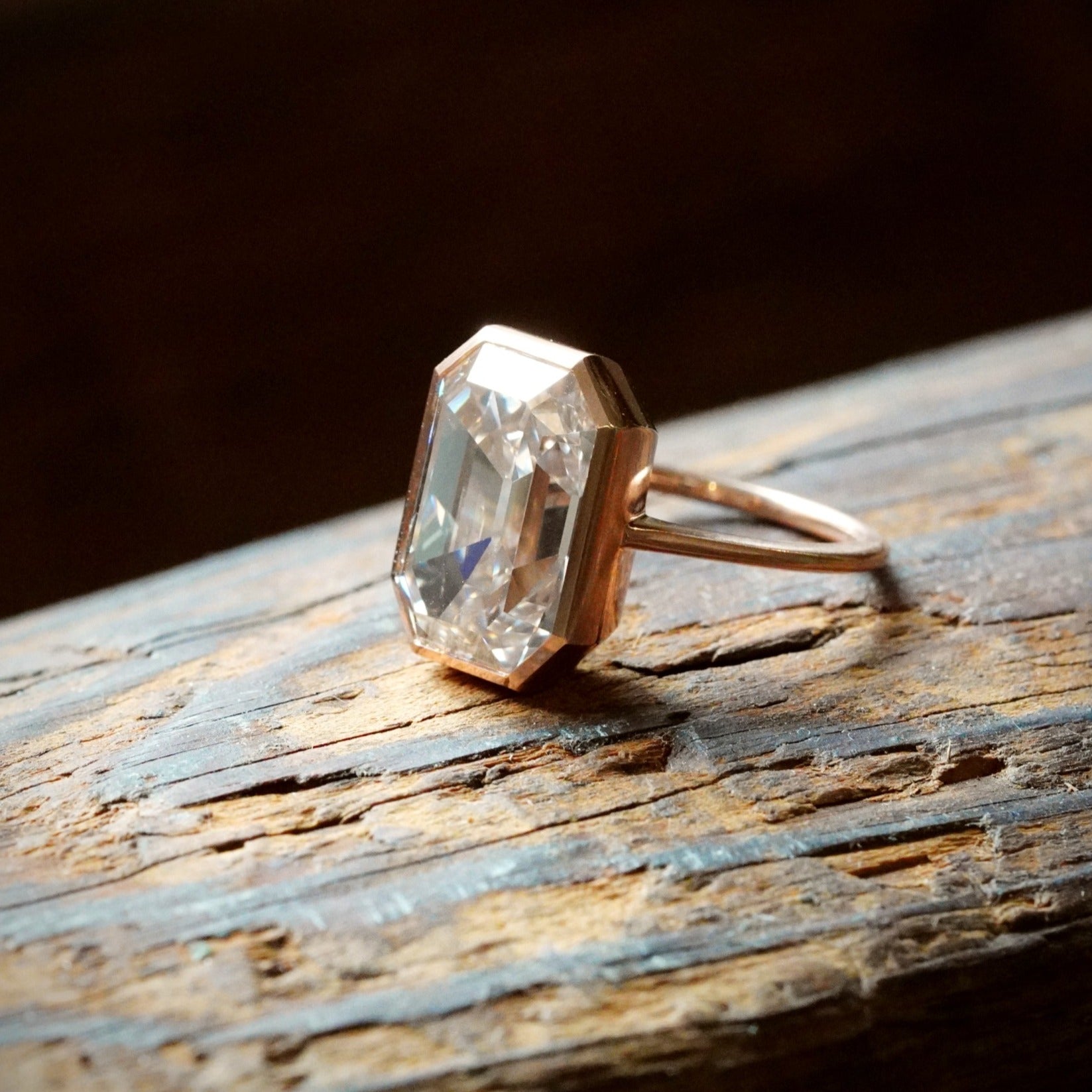 A breathtaking 8.06 ct Step Cut Diamond with a soft, faint brown hue, elegantly set in rose gold and platinum. A masterfully crafted statement piece, exclusively from Jogani.