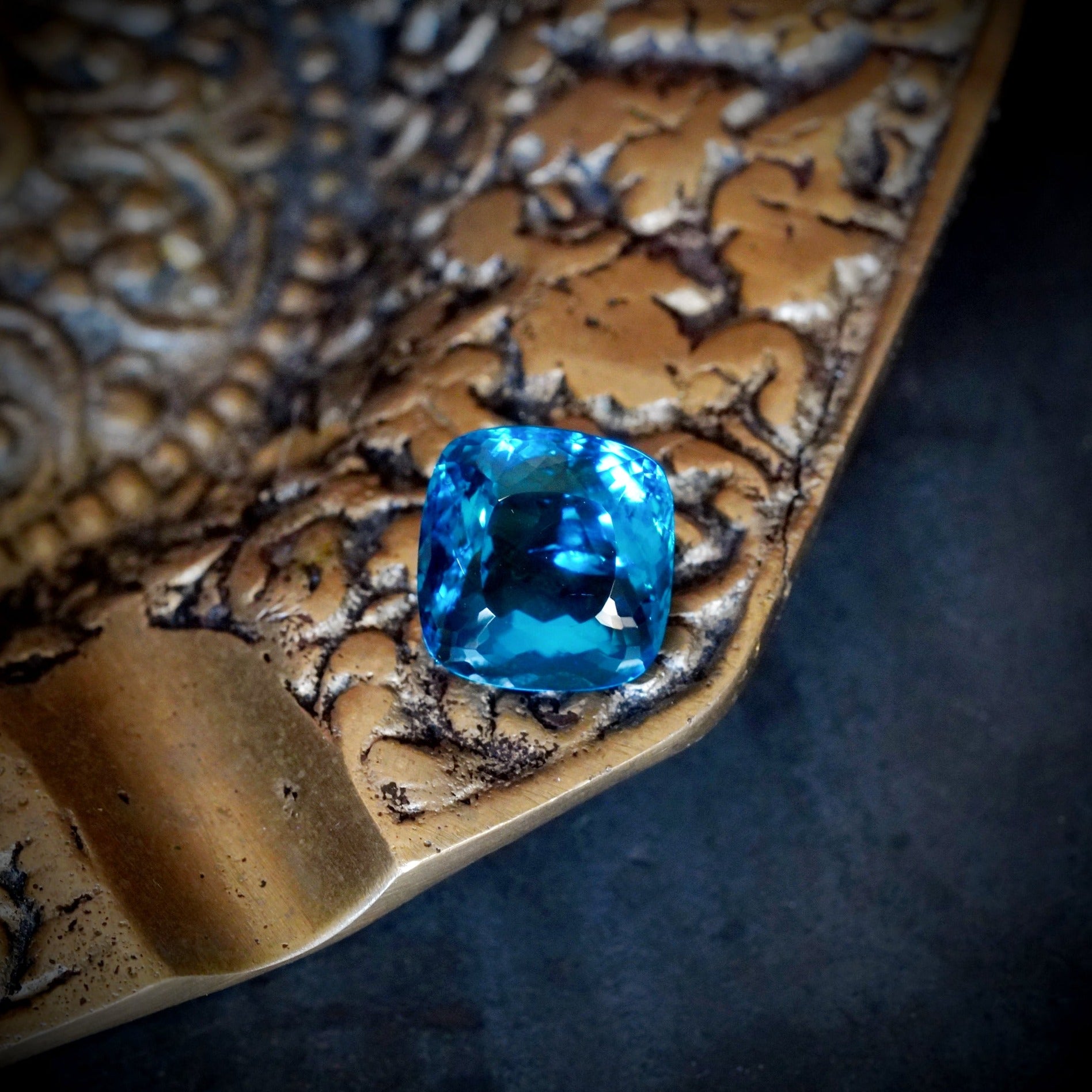 This exquisite 8.89 ct Brazilian Paraiba, in a Cushion Cut, radiates brilliance with its vivid blue tones and clean clarity—an extraordinary find offered by Jogani.