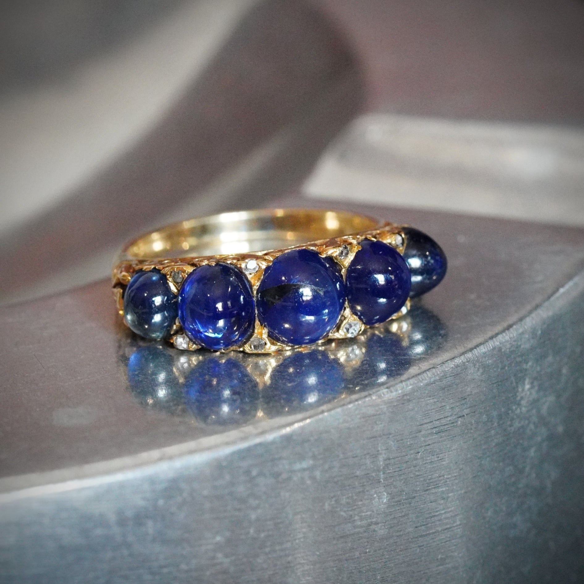 Victorian Azure Magic: A Five-Sapphire Ring Set in Yellow Gold
