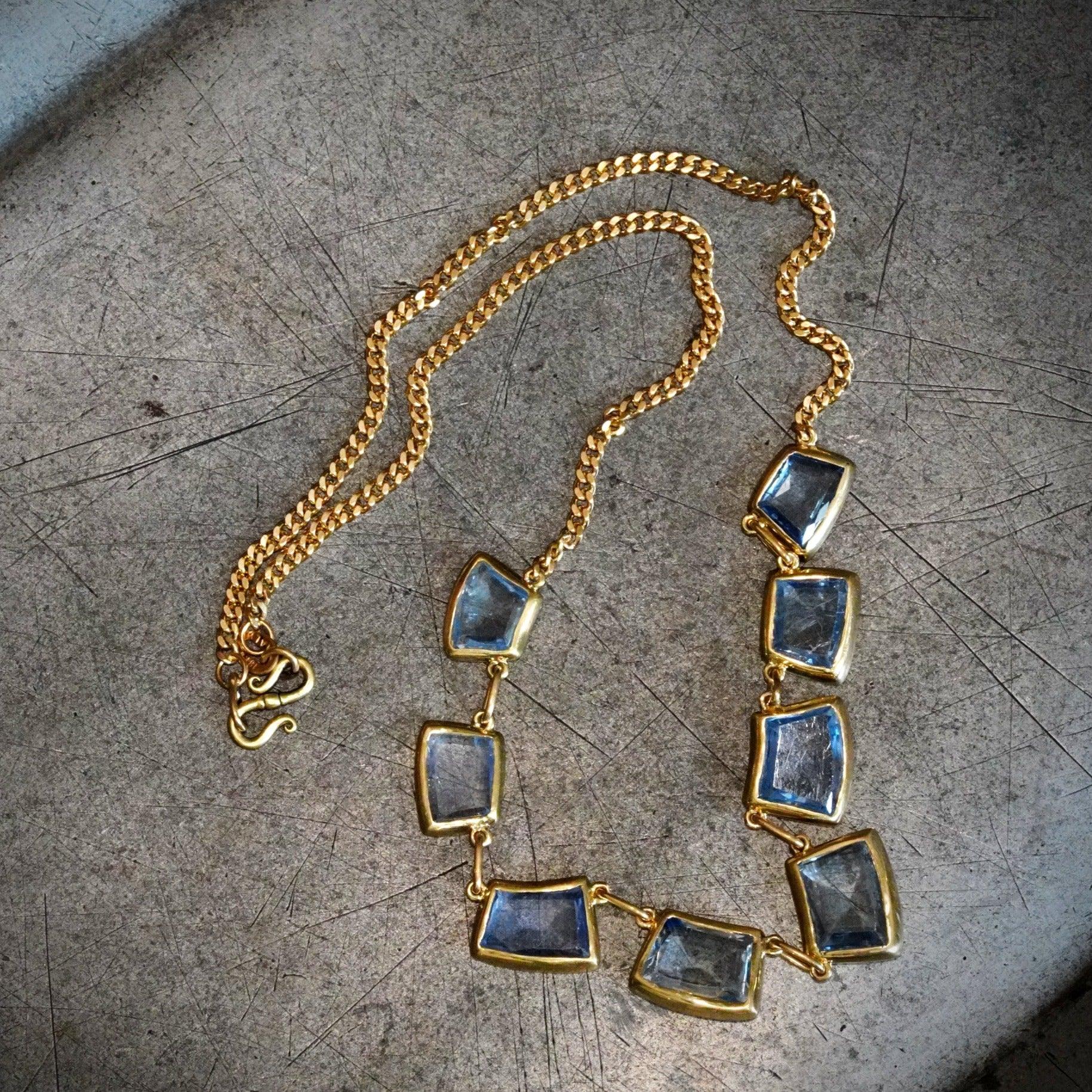 Luxury jewelry featuring Eternal Embrace trapezoidal sapphire by Jogani