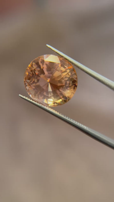 This rare, unheated 15.84 ct oval Ceylon sapphire, with its warm light orange hue, is an elegant gem for fine jewelry creations. Available now through Jogani.