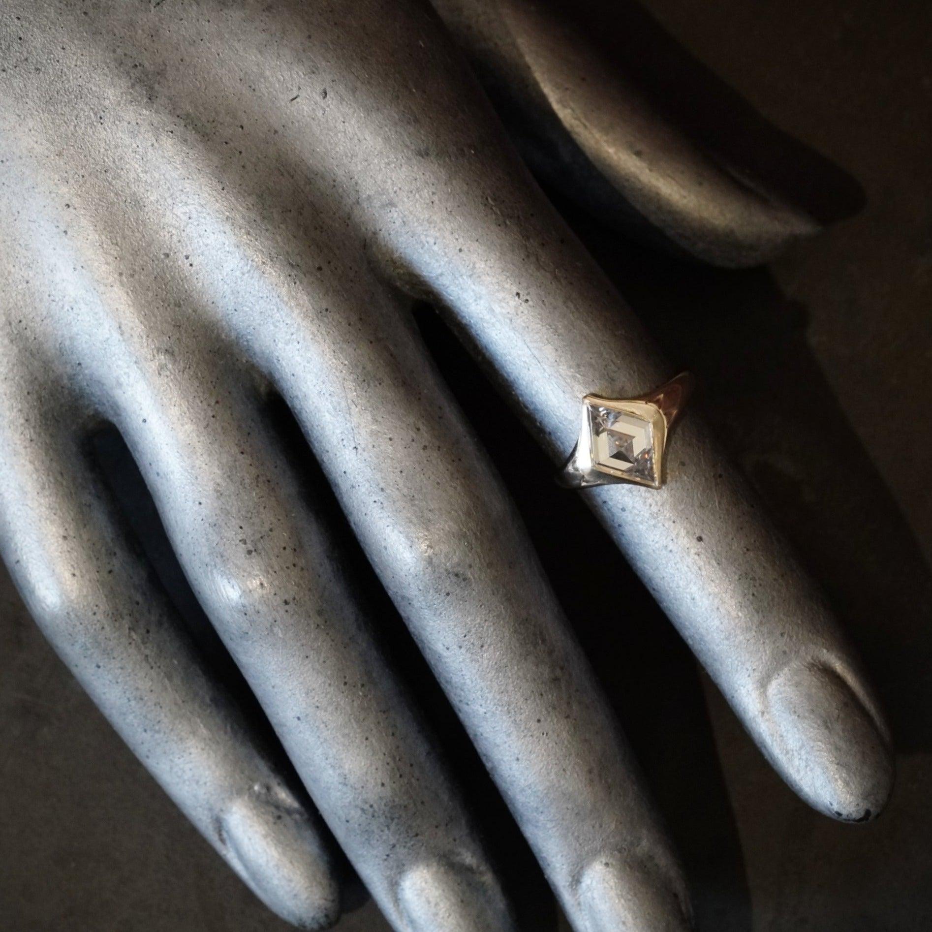 Luxury jewelry featuring the stunning 2.12 CT lozenge step cut diamond by Jogani